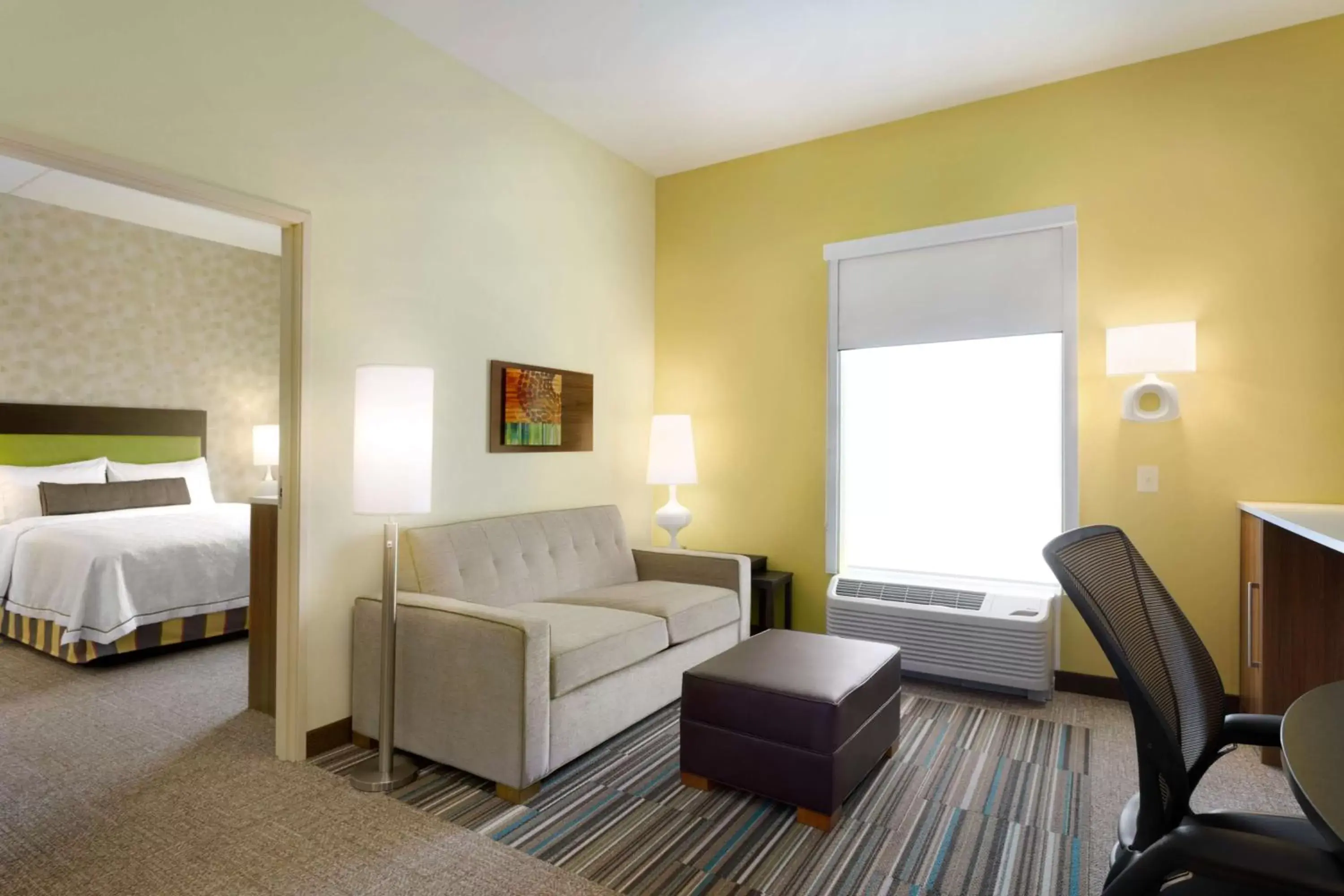 Living room, Bed in Home2 Suites by Hilton Charlotte Airport