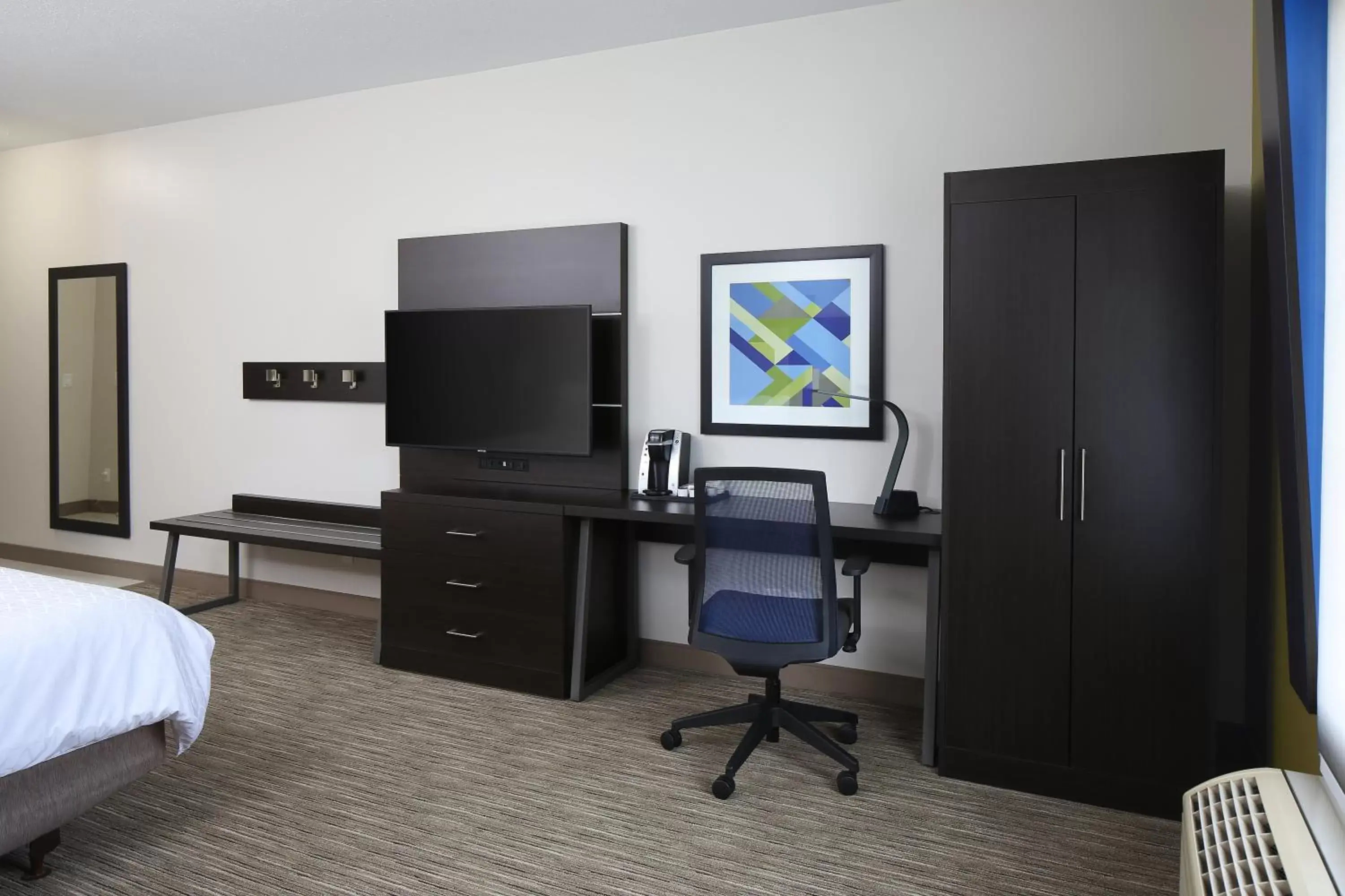 Photo of the whole room, TV/Entertainment Center in Holiday Inn Express Grand Rapids Southwest, an IHG Hotel