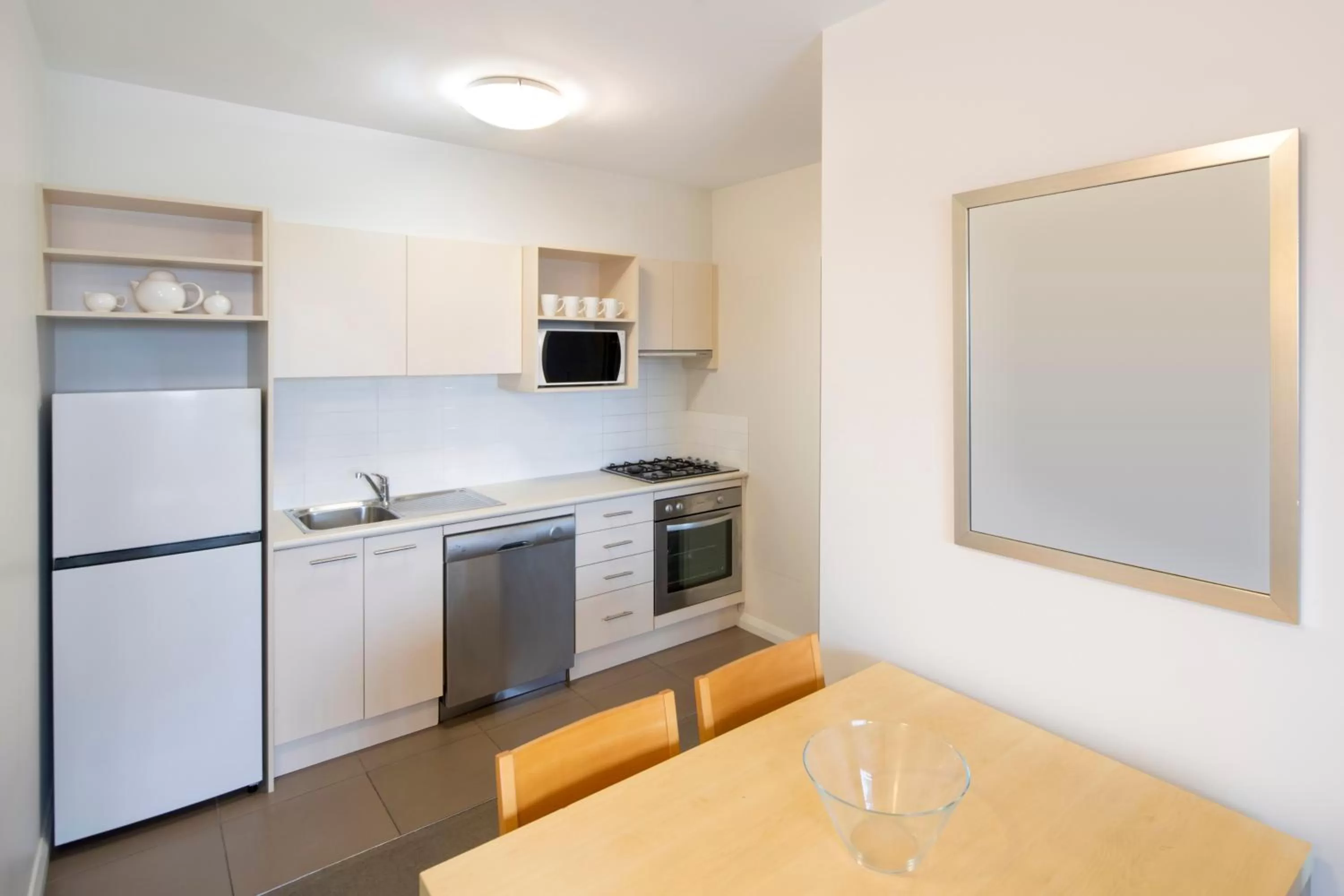 Kitchen or kitchenette in Mantra Castle Hill Sydney, an Accor Hotel