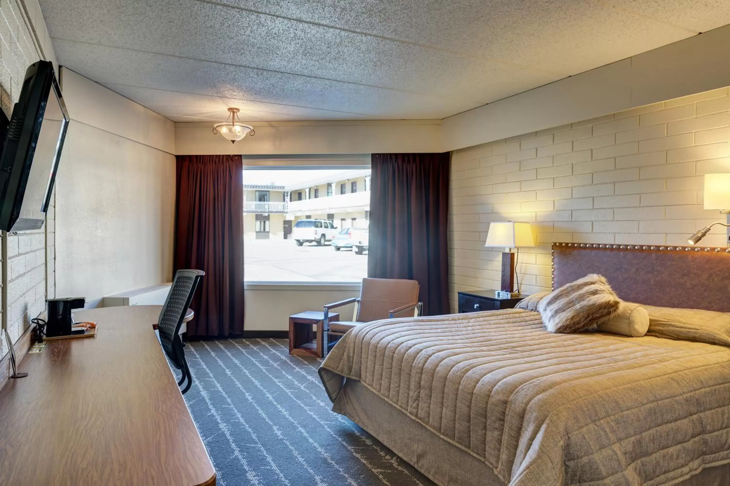 Photo of the whole room, Bed in El Rancho Hotel Photo of the whole room, Bed in El Rancho Hotel