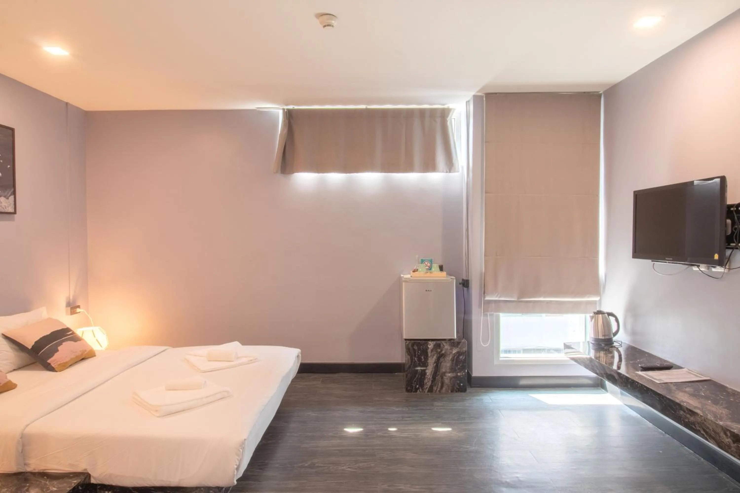 Photo of the whole room, TV/Entertainment Center in CheQinn Hostel - Sukhumvit 4 Nana Plaza