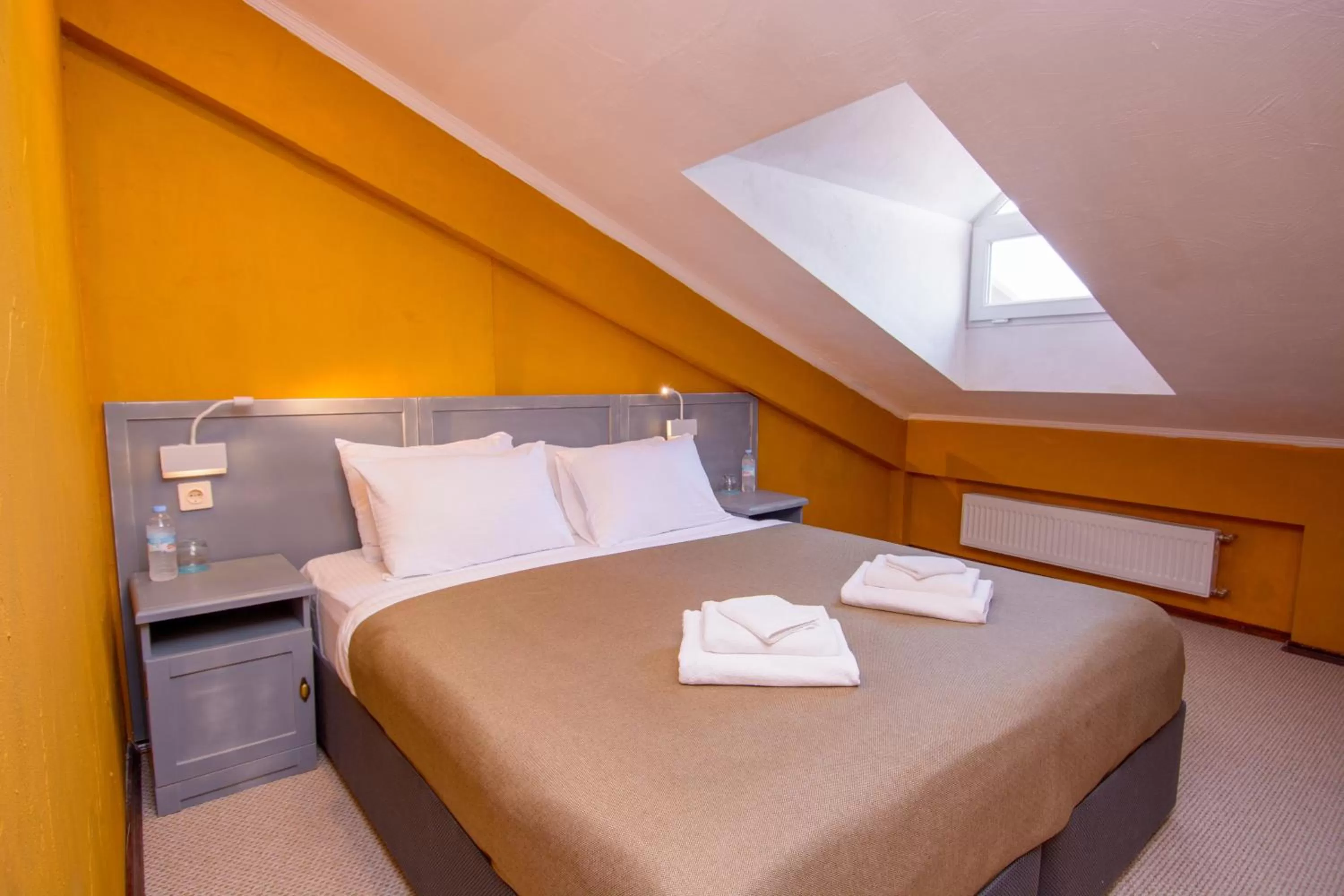 Bed in Kindli Boutique Hotel