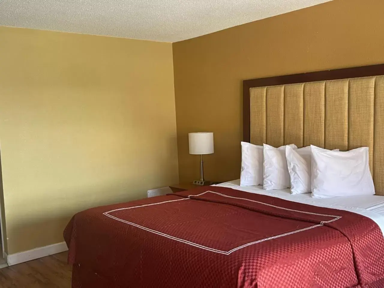 Bed in Atlantic Shores Inn and Suites