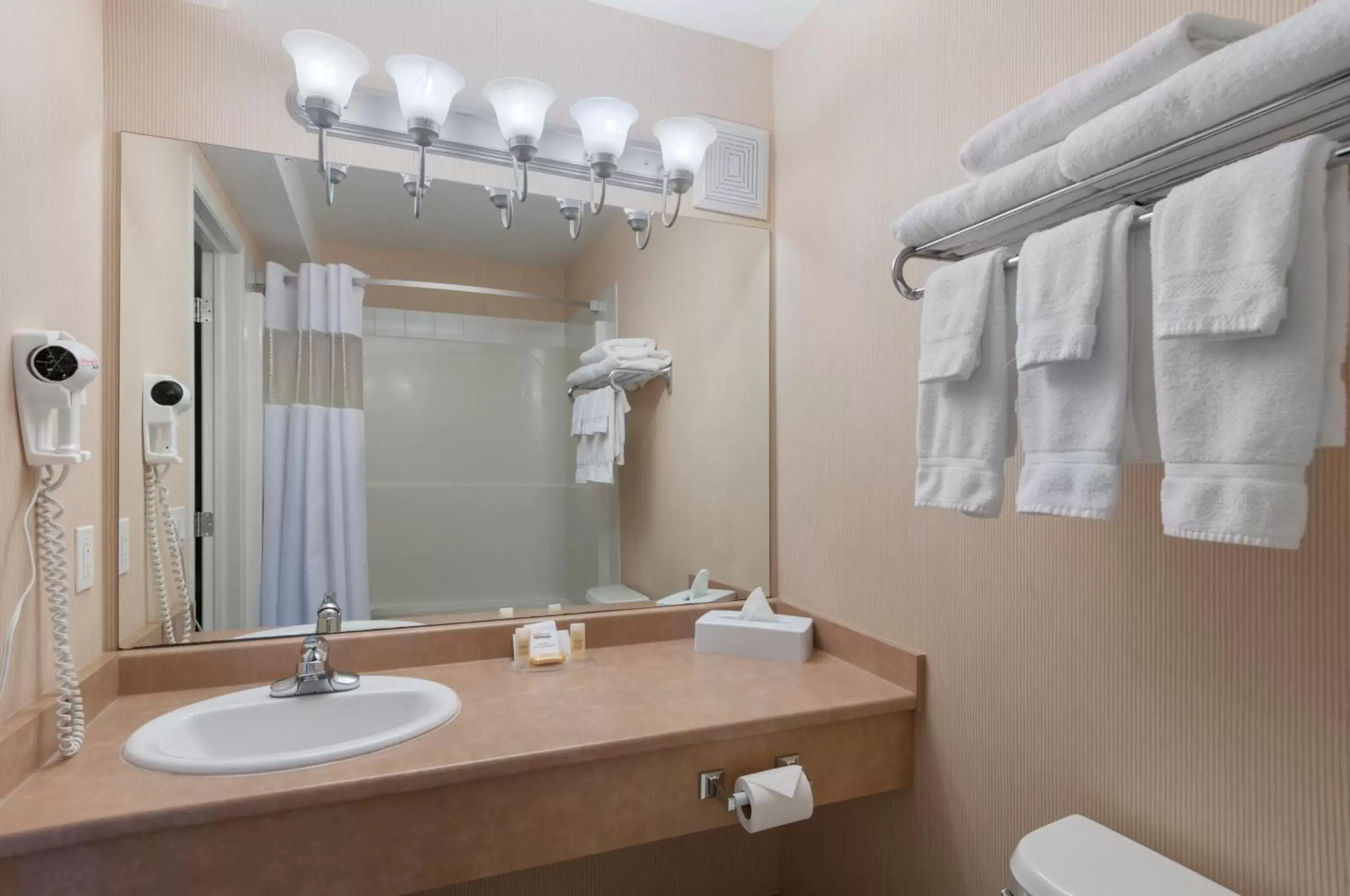 Bathroom in Days Inn & Suites by Wyndham Cochrane