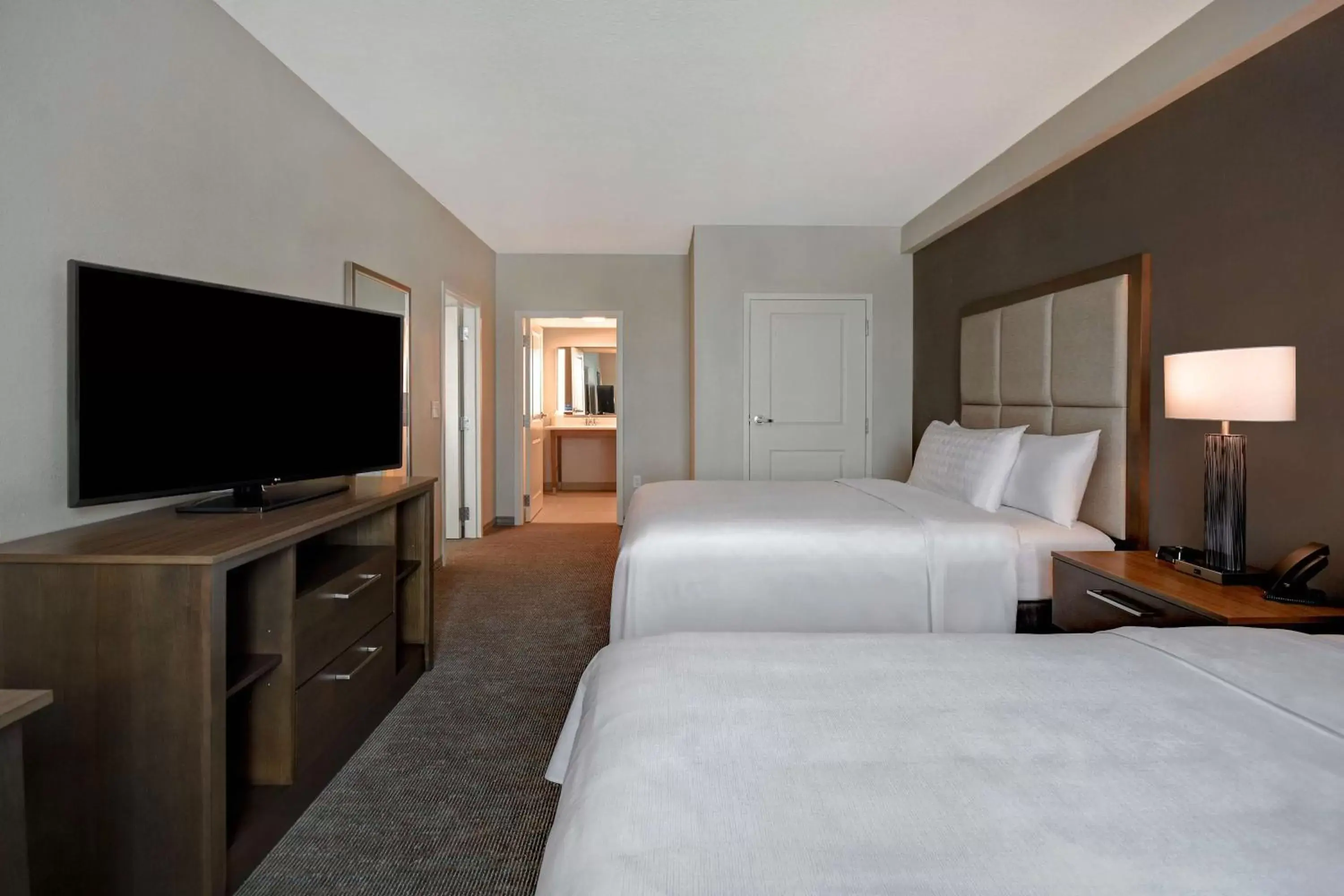 Bed, TV/Entertainment Center in Homewood Suites By Hilton Orlando Flamingo Crossings, Fl