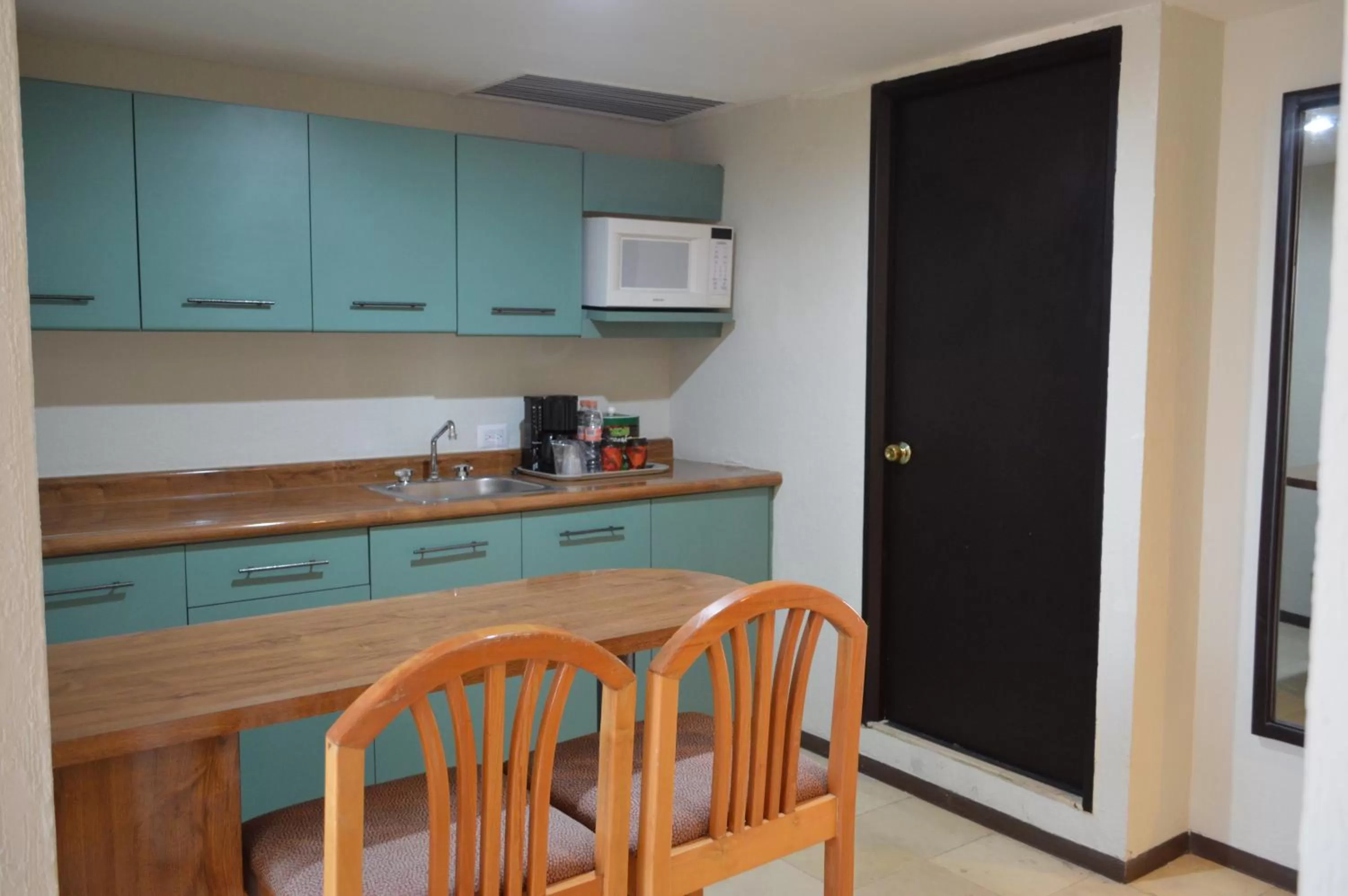 Kitchen or kitchenette in Ramada Hola Culiacan