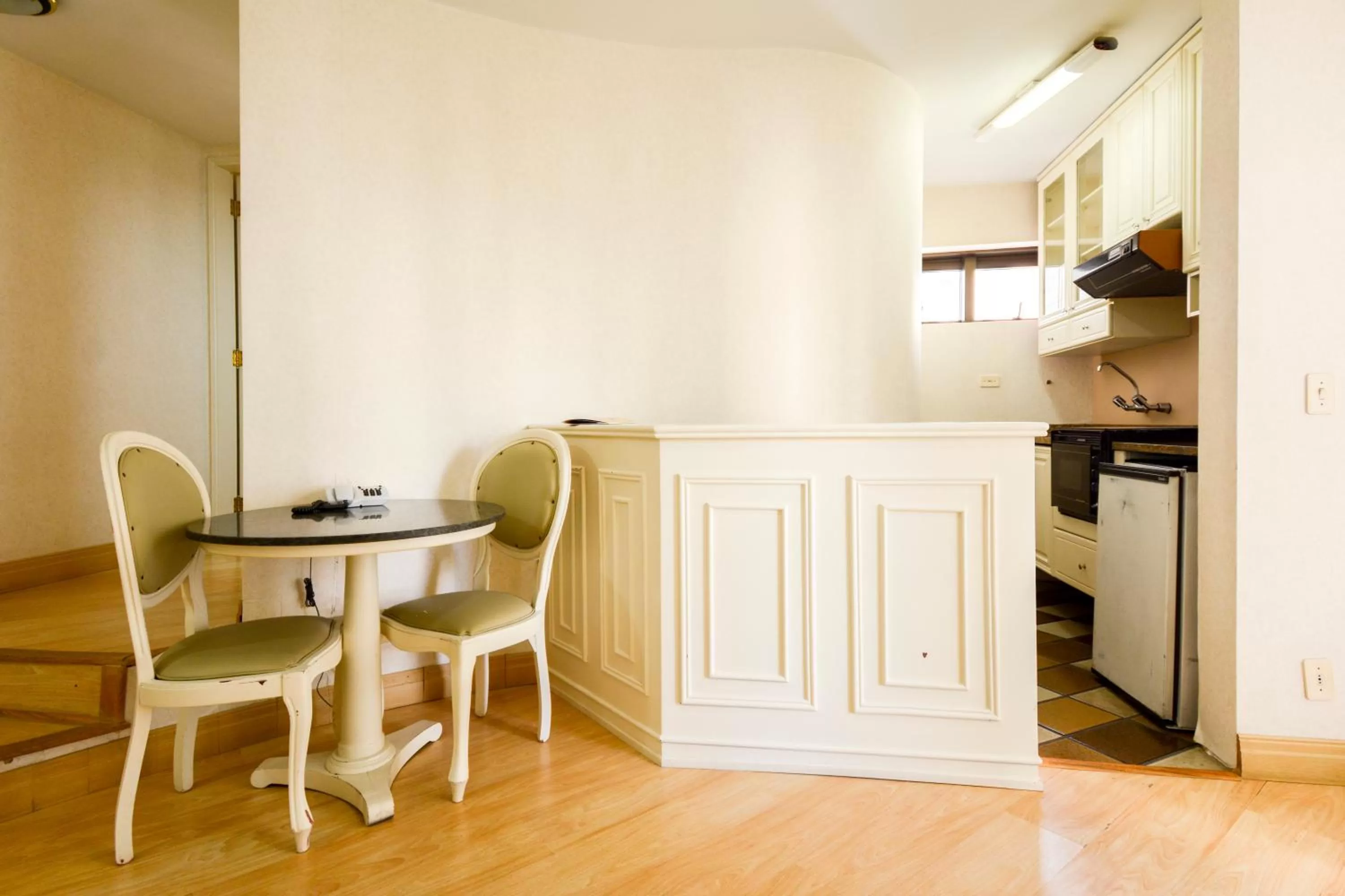 Kitchen or kitchenette, Dining Area in Wall Street Apartments by BnbHost