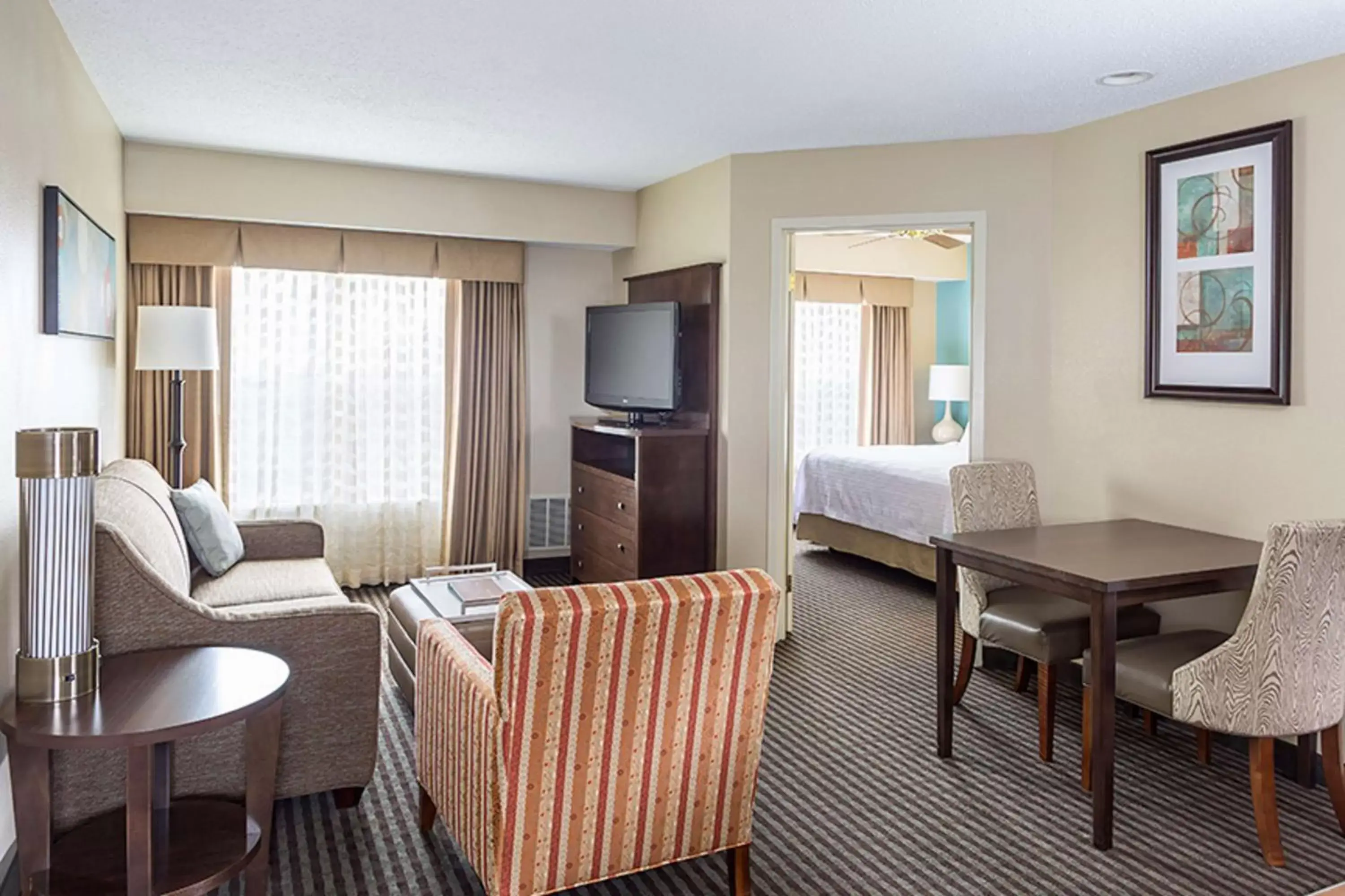 Bed, Seating Area in Homewood Suites Grand Rapids