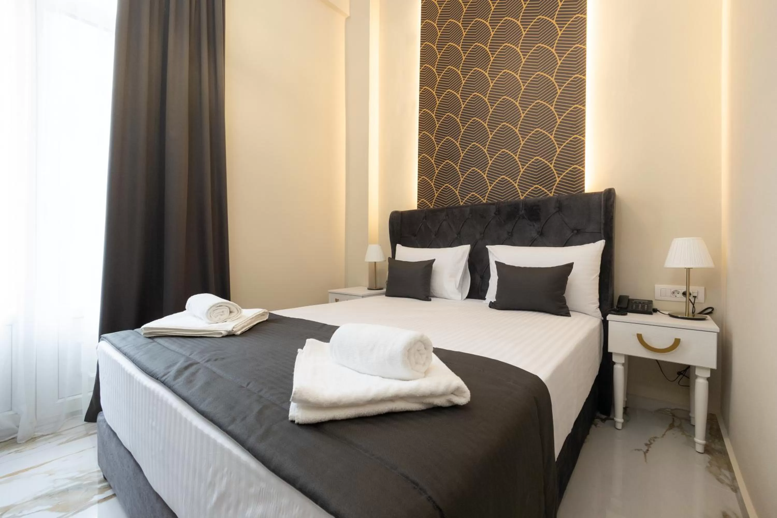 Bed in Modern Revival Luxury Hotel