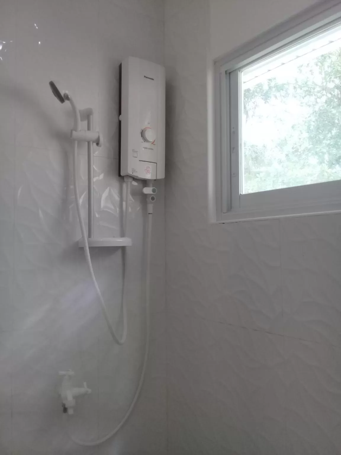 Shower in D & B BLUESTAR BEACH RESORT