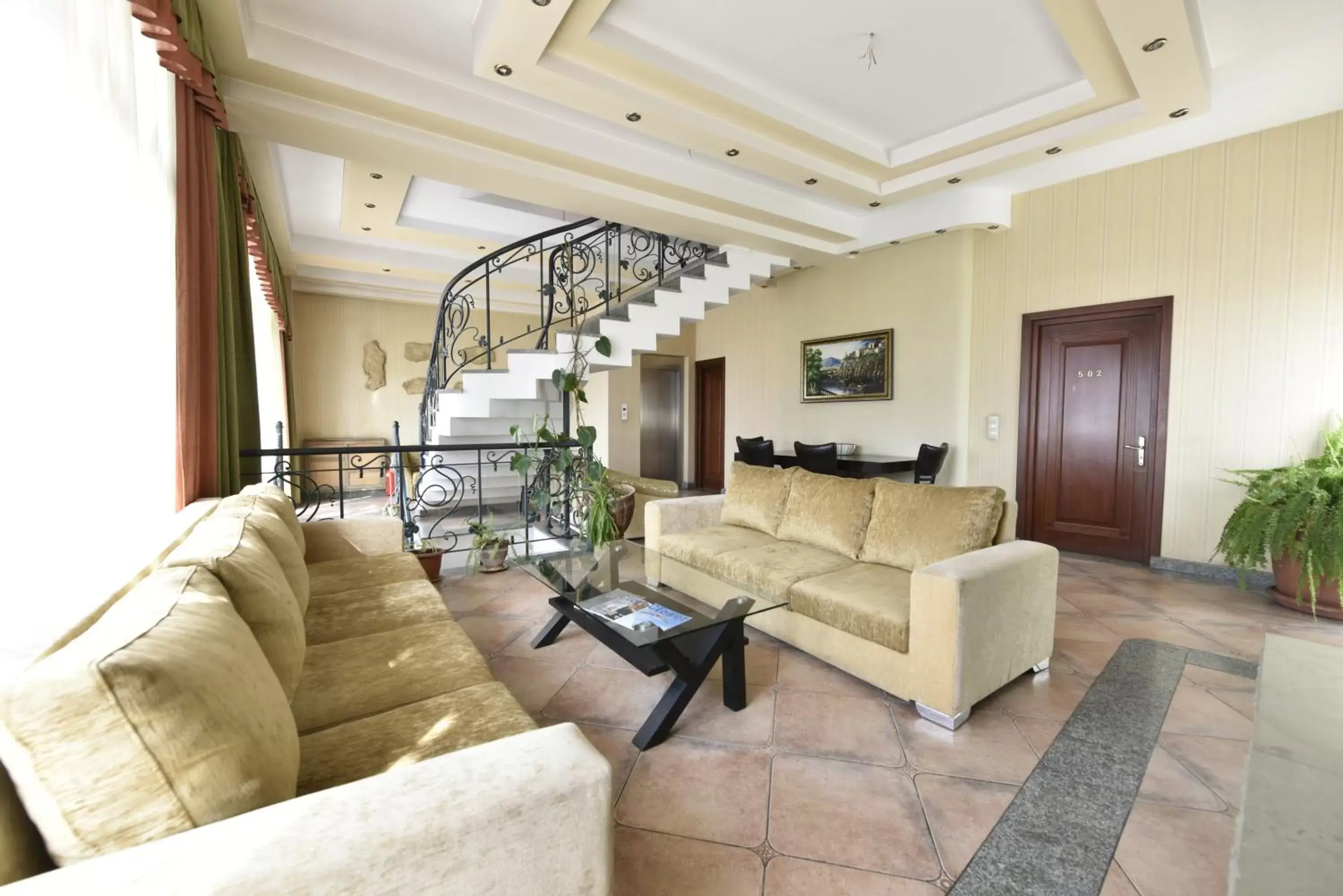 Communal lounge/ TV room, Seating Area in Irmeni Hotel