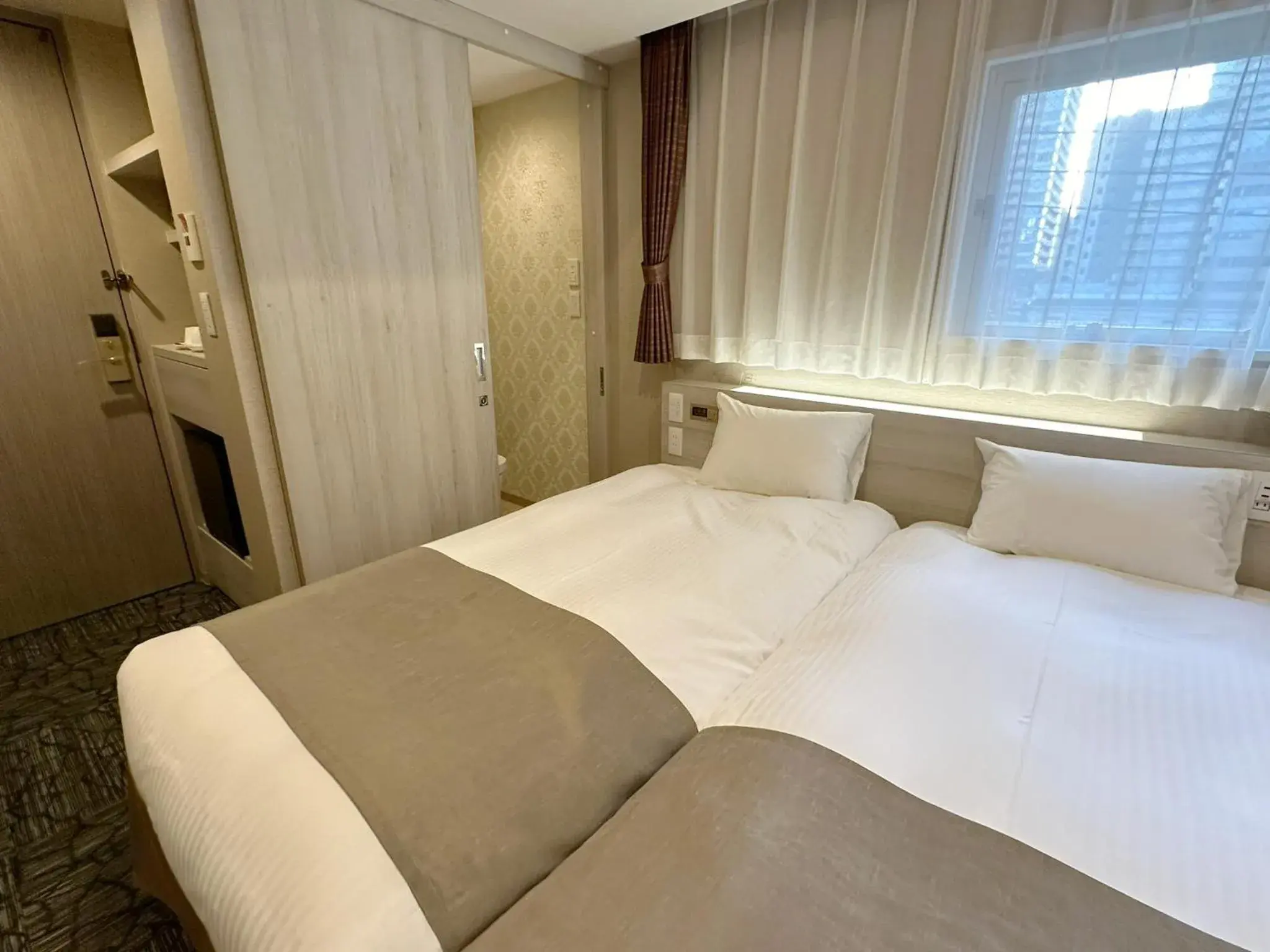 Bed in S.Training Center Hotel