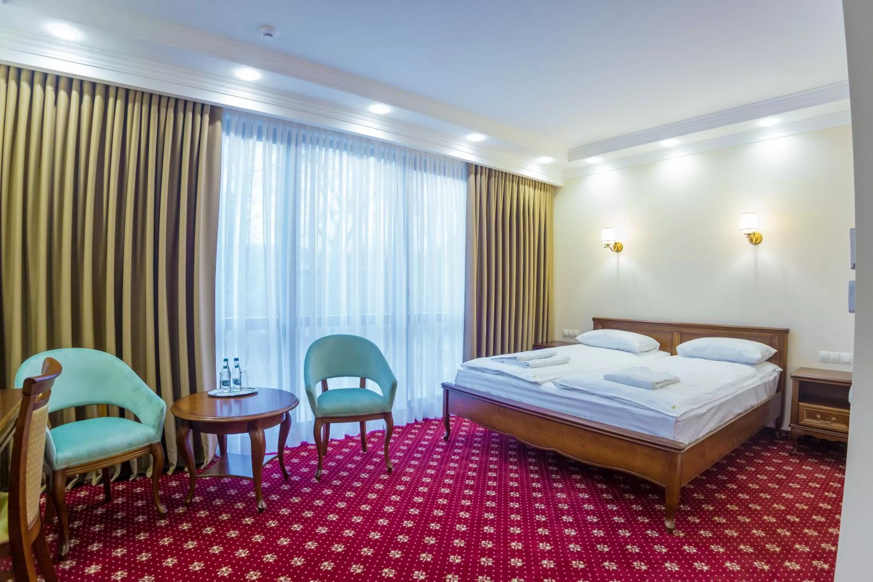 Bed in Ambassador Hotel