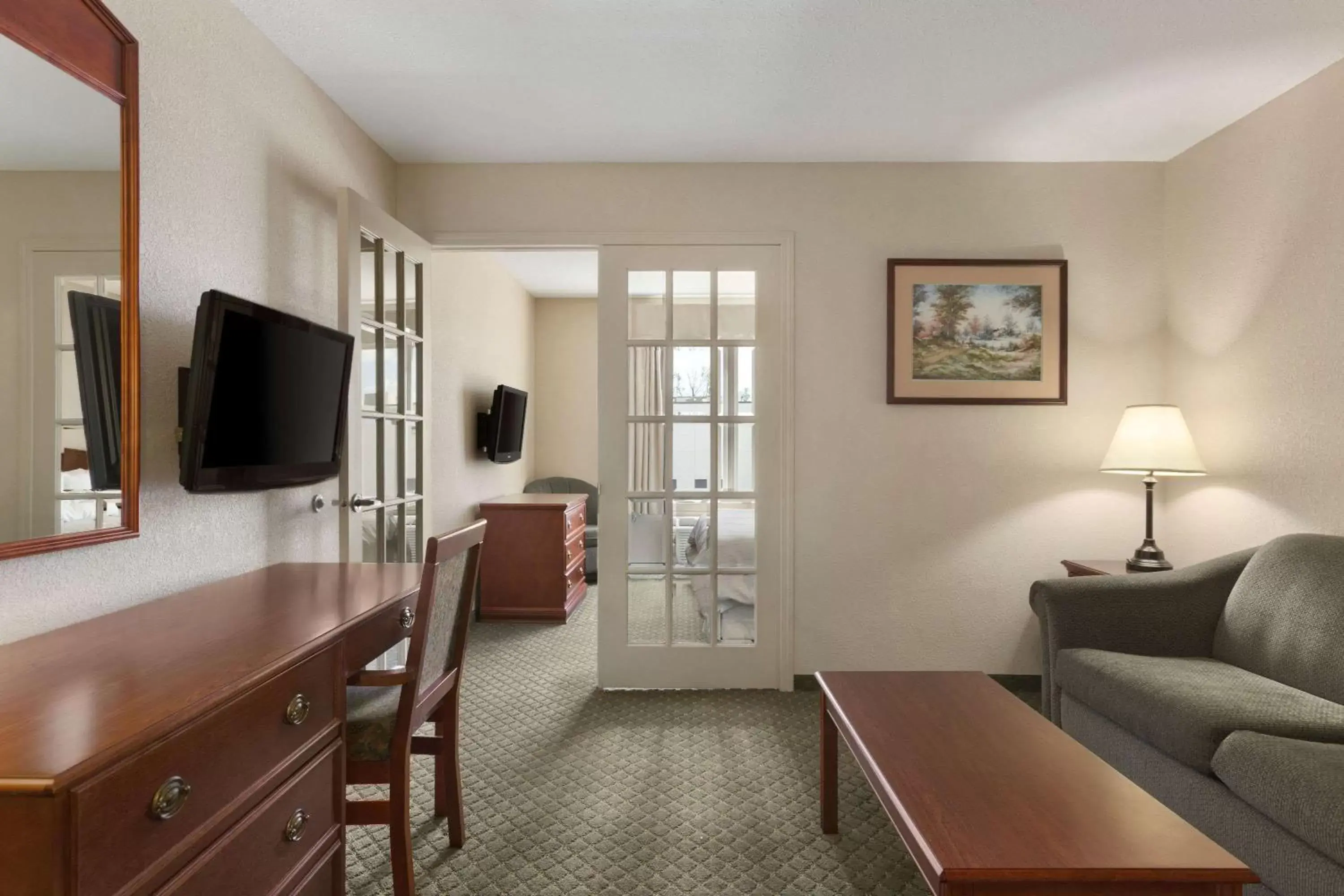 Photo of the whole room, TV/Entertainment Center in Days Inn & Suites by Wyndham Winkler