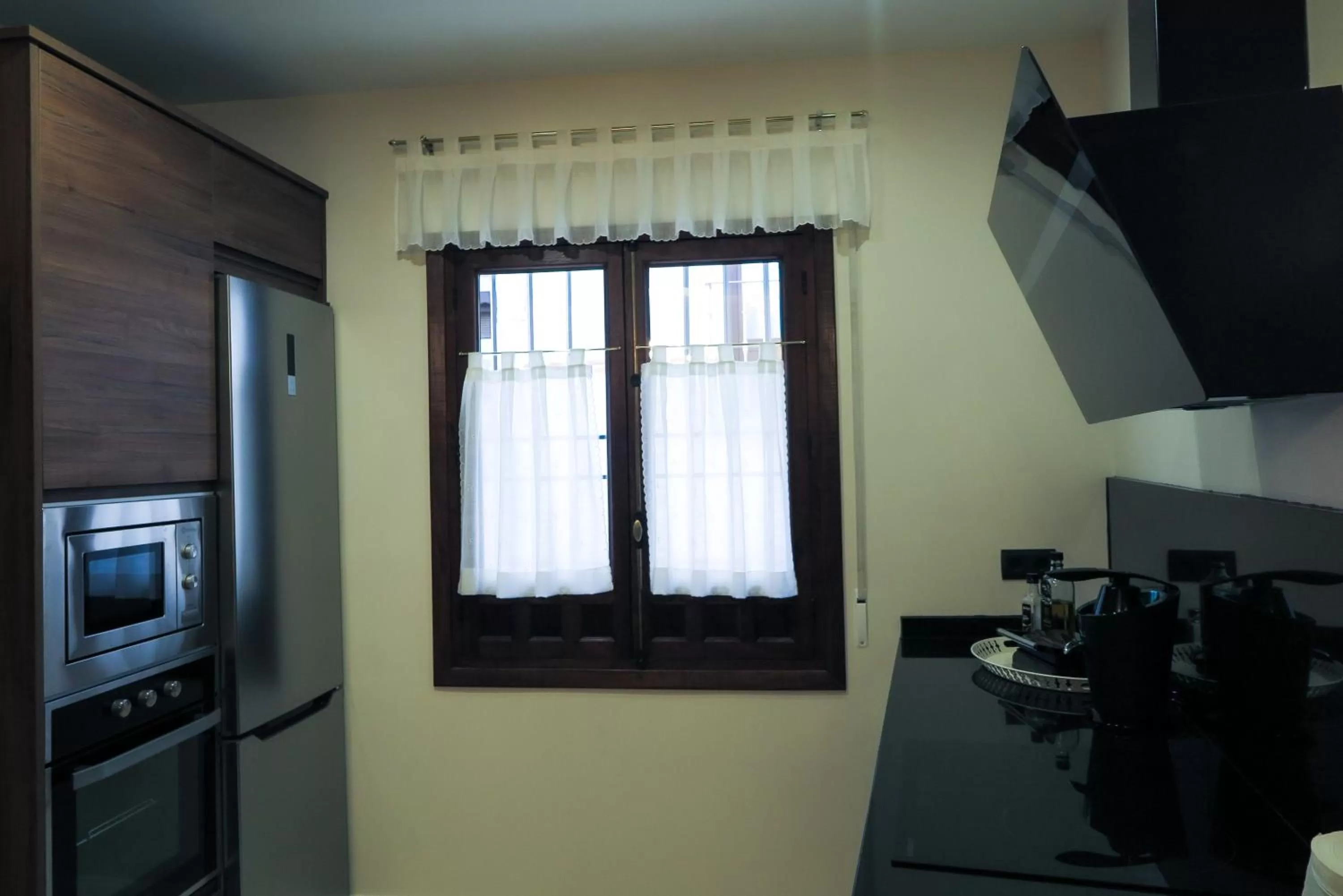 Kitchen or kitchenette, TV/Entertainment Center in Tomé, casa de huéspedes