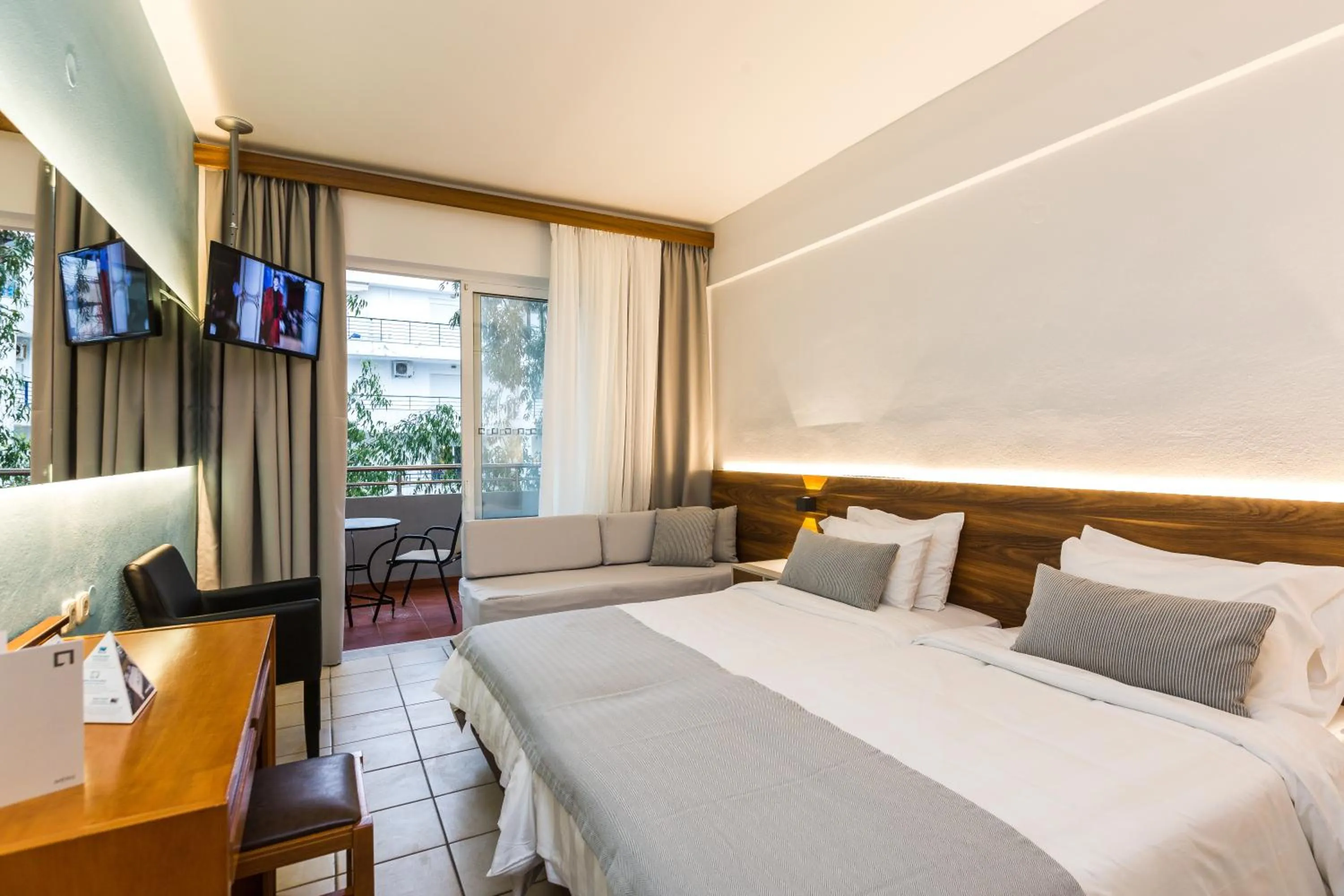 Bed in Atrium Ambiance Hotel