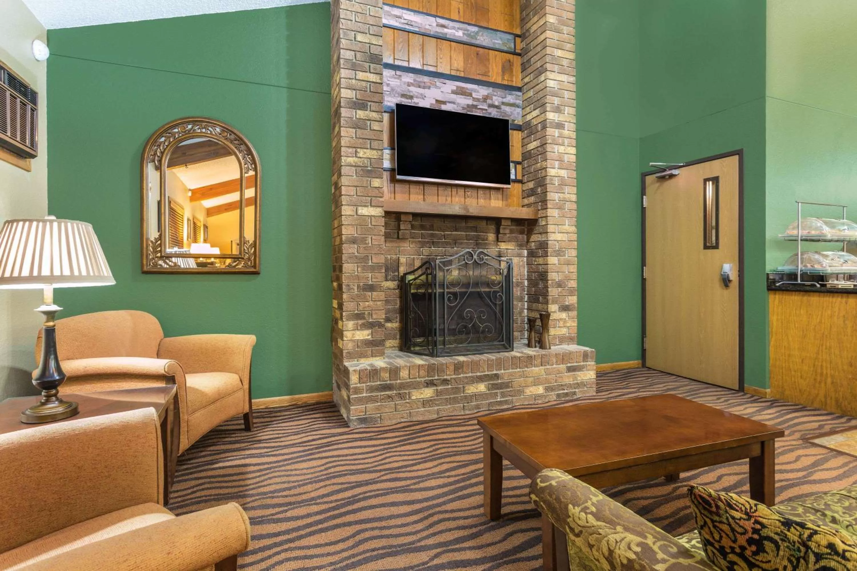 Lobby or reception in AmericInn by Wyndham West Bend