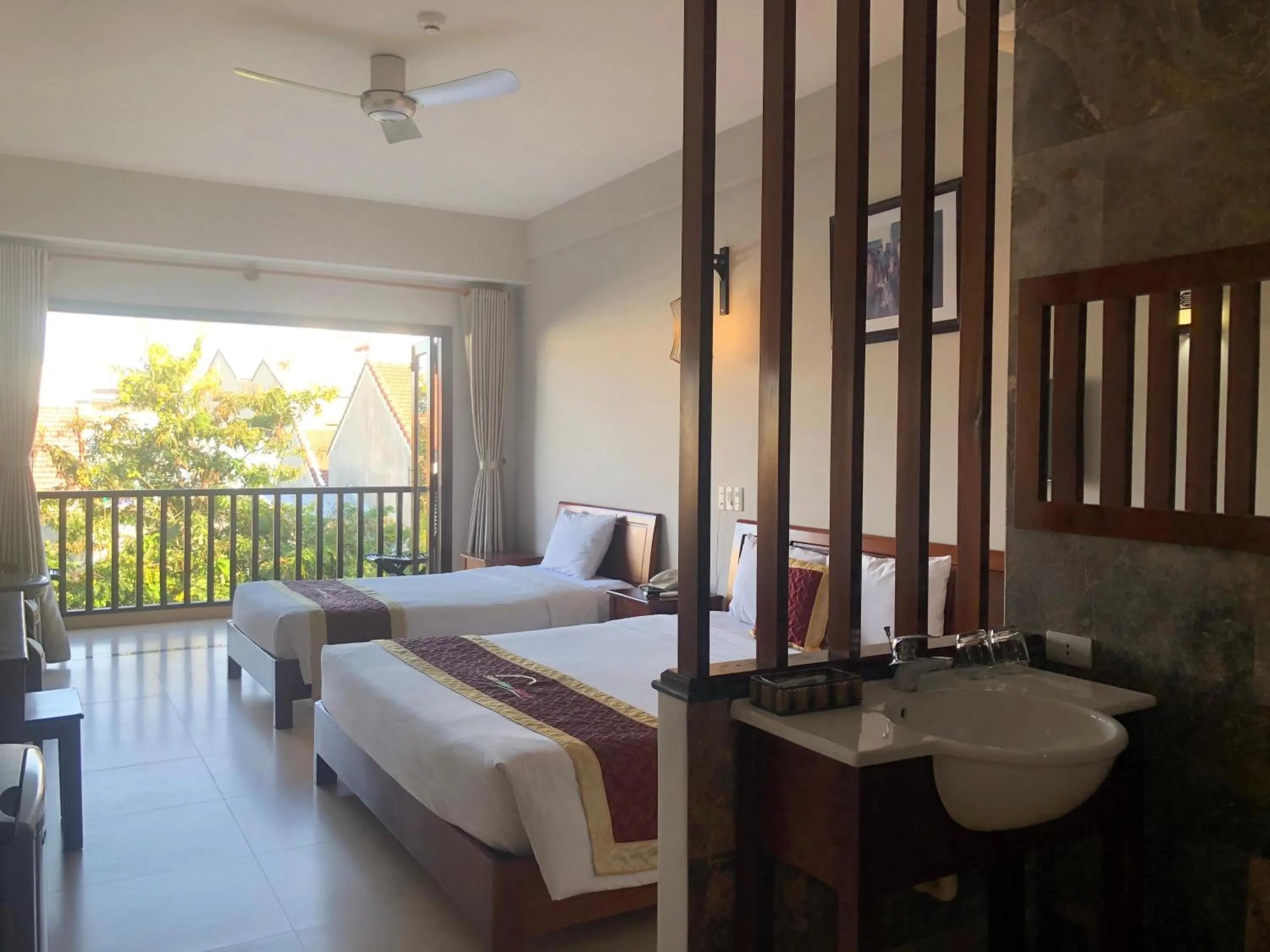 Bed in Sunshine Hoian Hotel