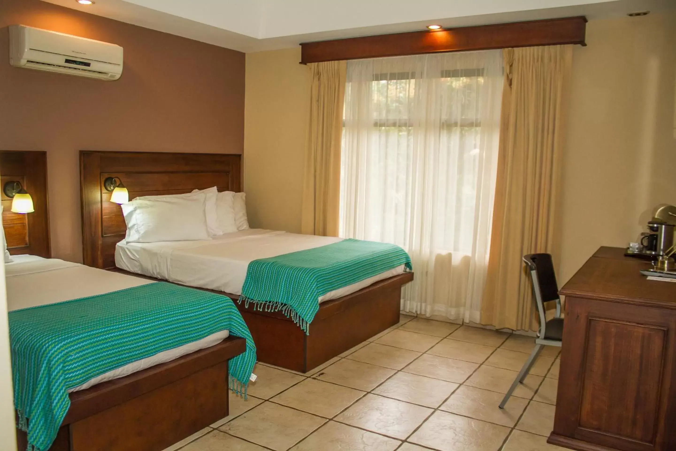 Bed in La Riviera Hotel