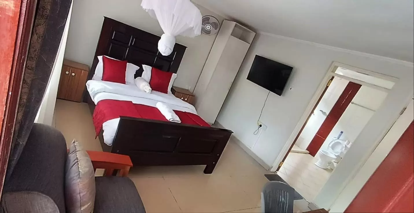 Toilet, TV/Entertainment Center in Milimani Comfort