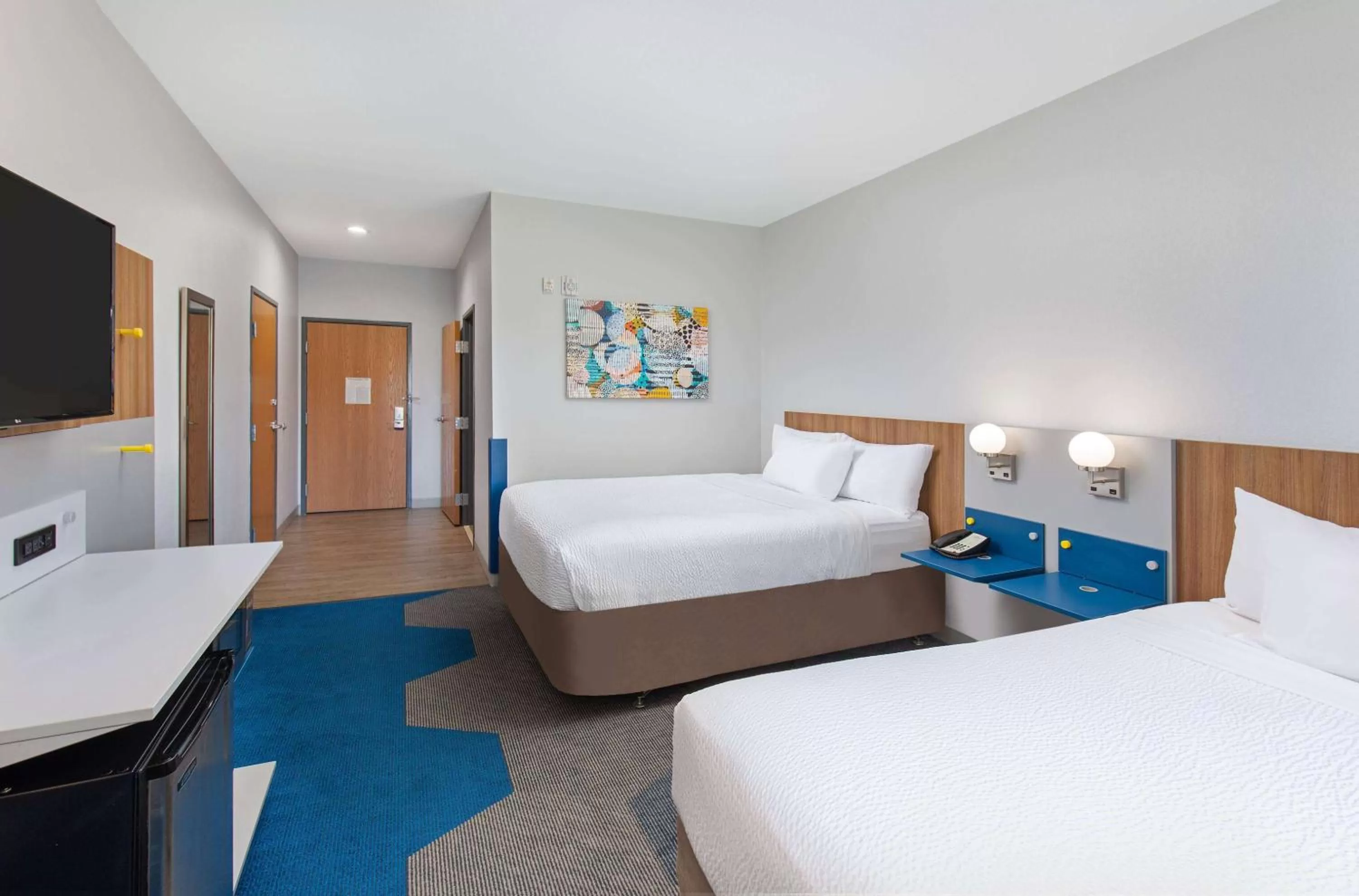 Bed in Microtel Inn and Suites by Wyndham