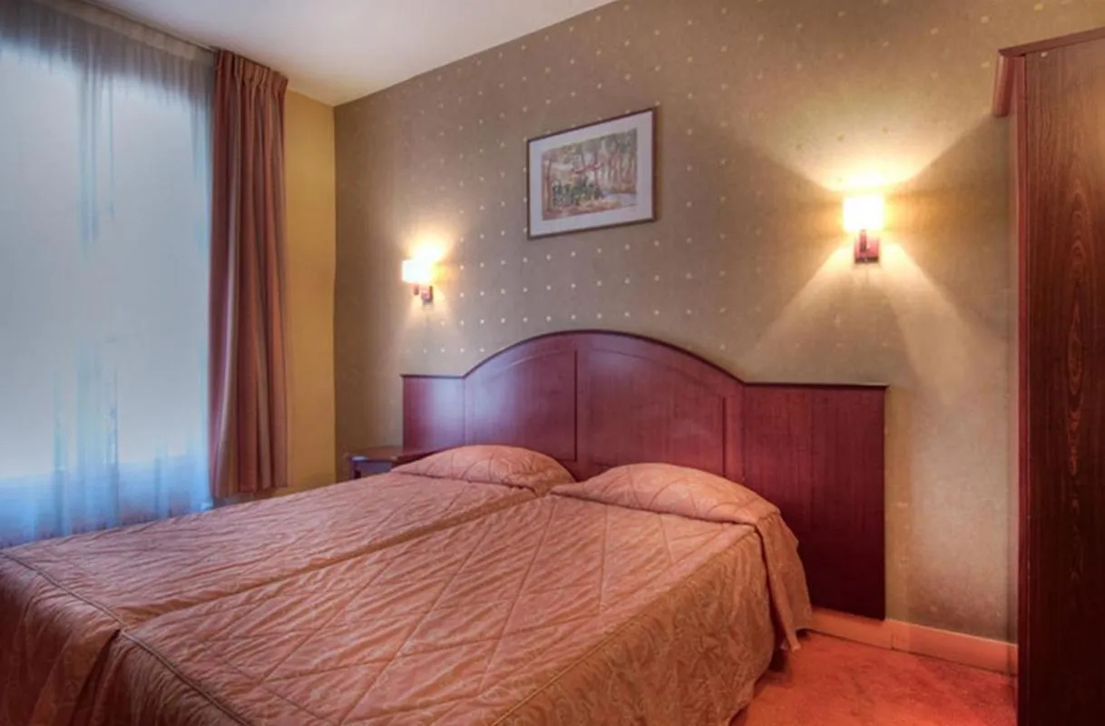 Bed in Hotel Le Faubourg Opera