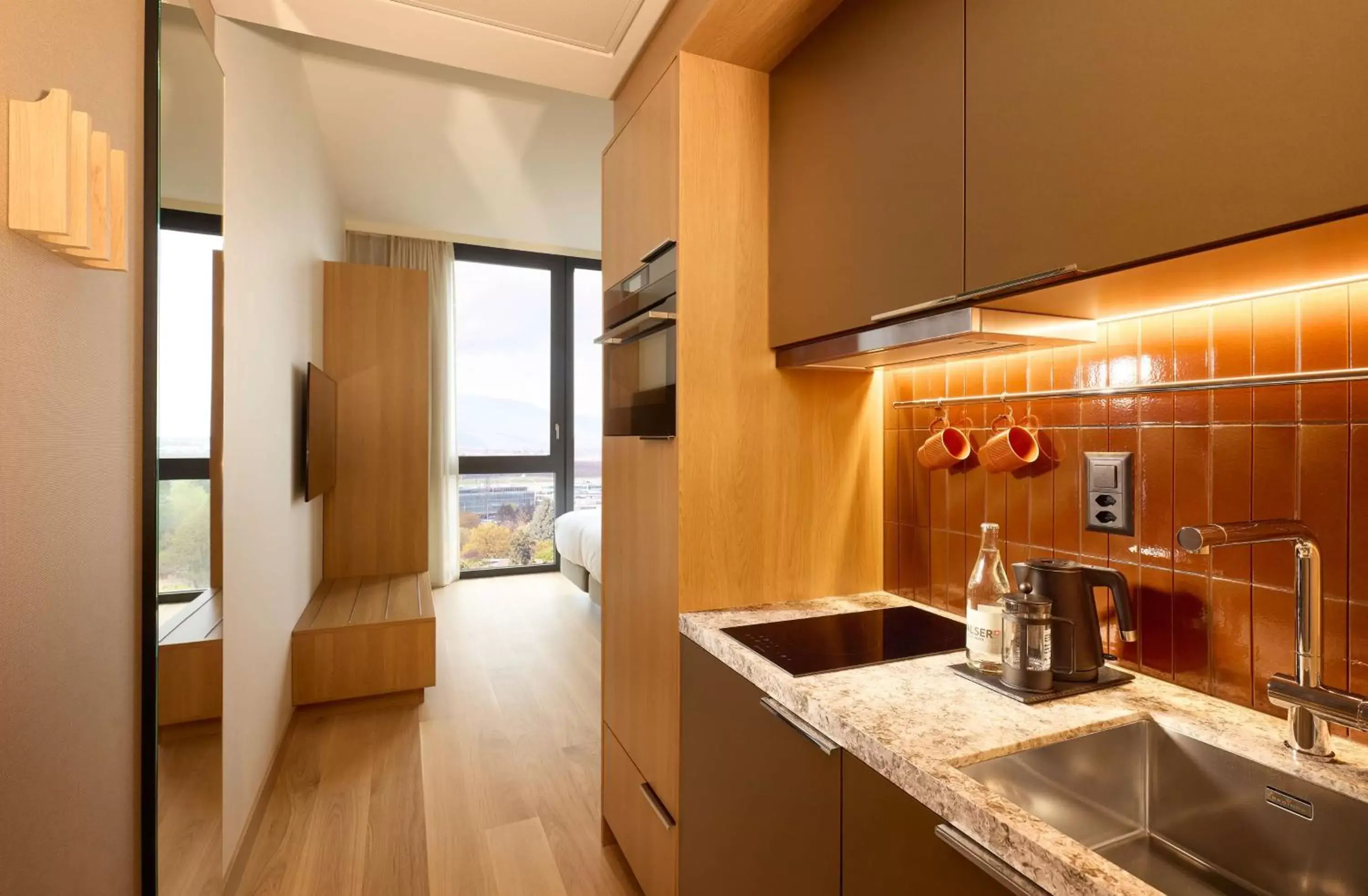 Bedroom, Kitchen/Kitchenette in Adina Apartment Hotel Geneva