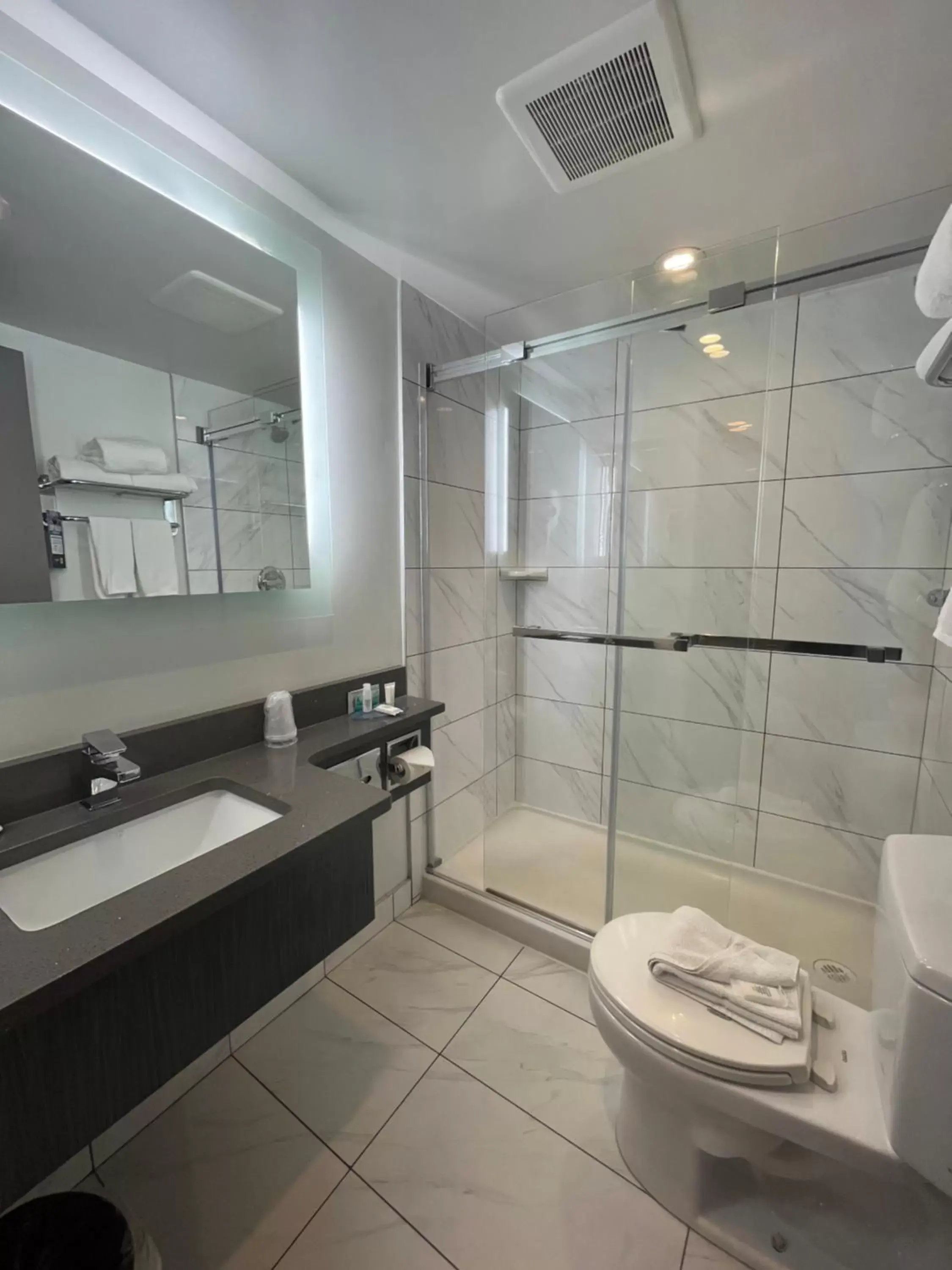 Shower, Bathroom in Super 8 by Wyndham Macleod Trail Calgary