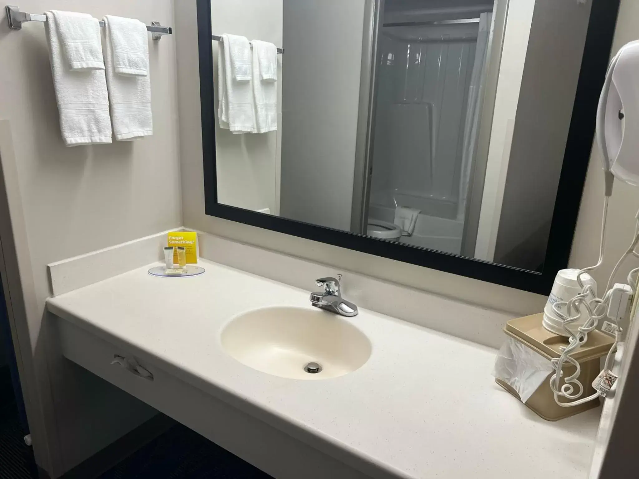 Bathroom in Days Inn by Wyndham Valdosta at Rainwater Conference Center