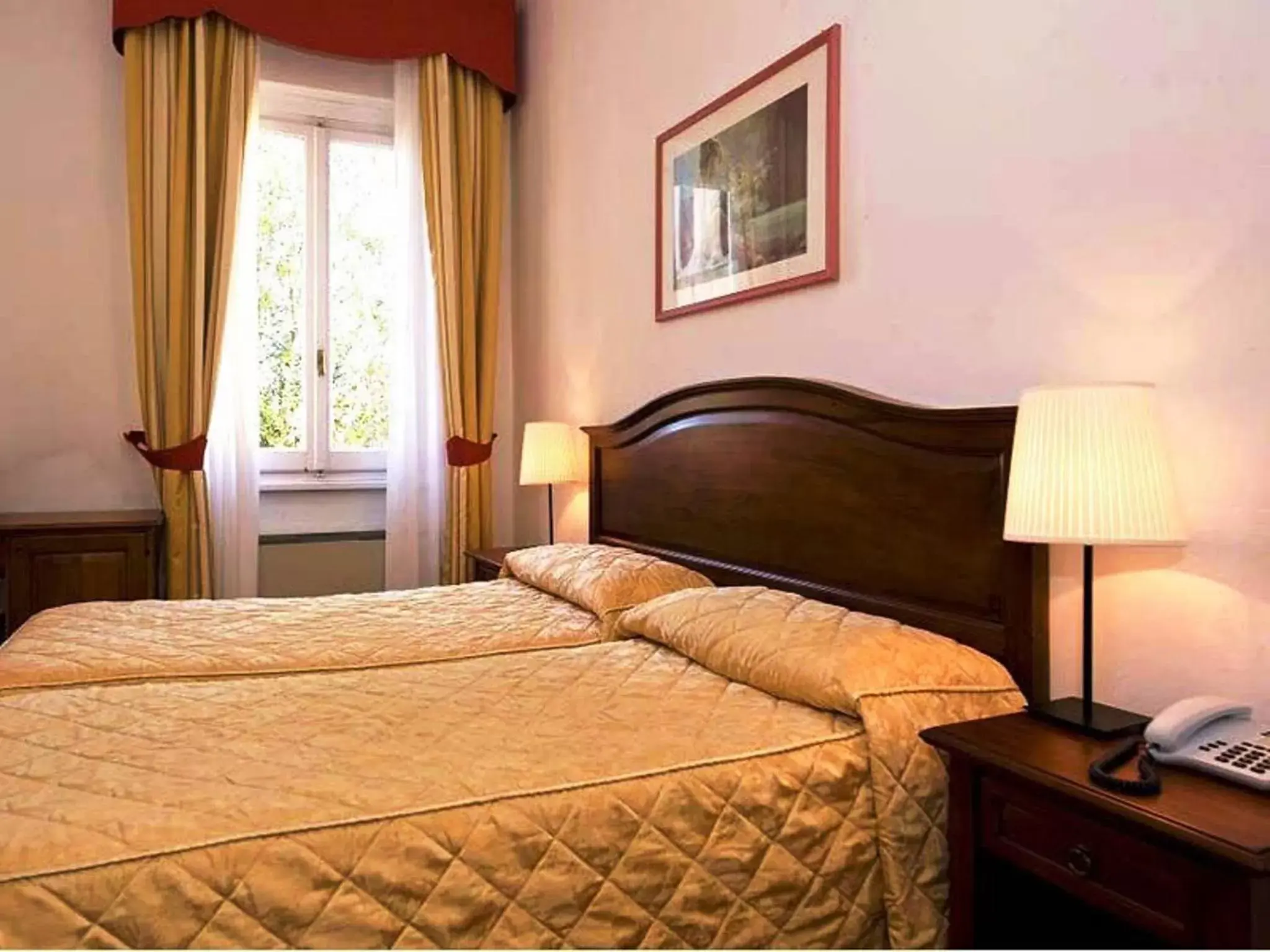 Bed in Hotel Vasari