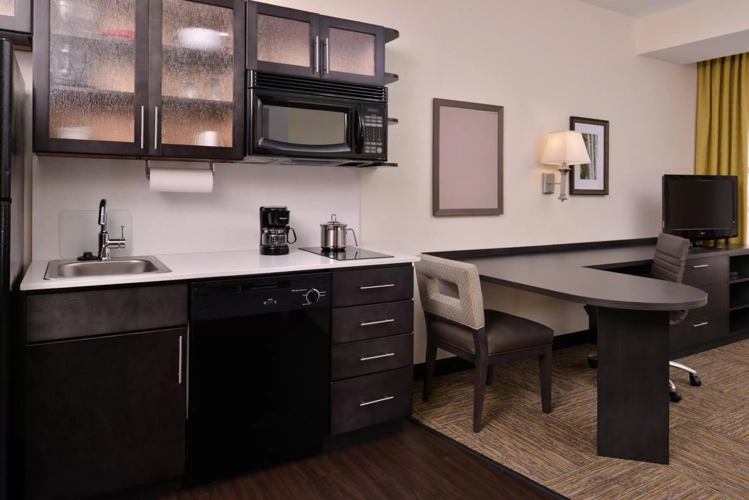 Photo of the whole room, Kitchen/Kitchenette in Candlewood Suites Terre Haute, an IHG Hotel