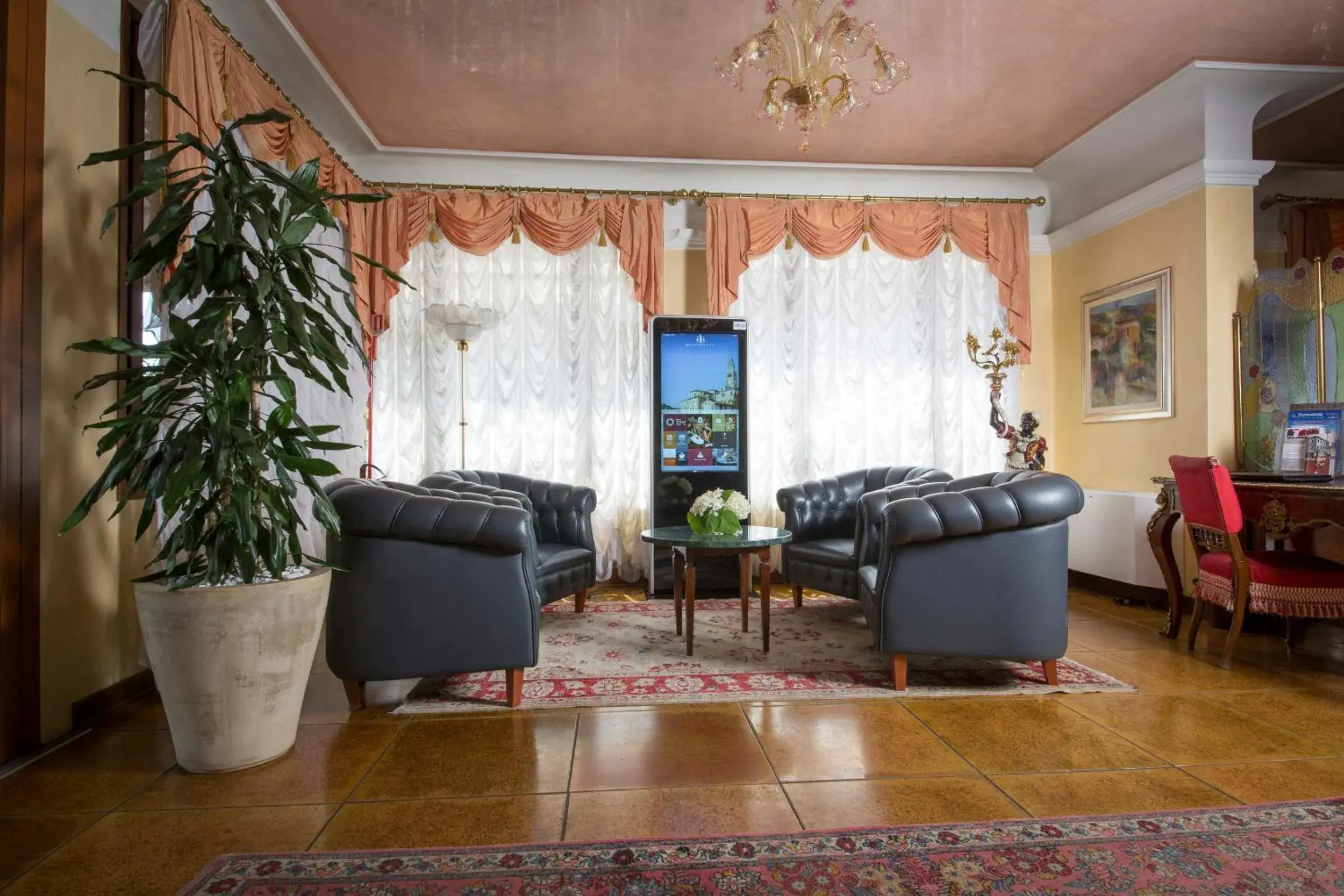 Communal lounge/ TV room, Seating Area in Hotel Spessotto