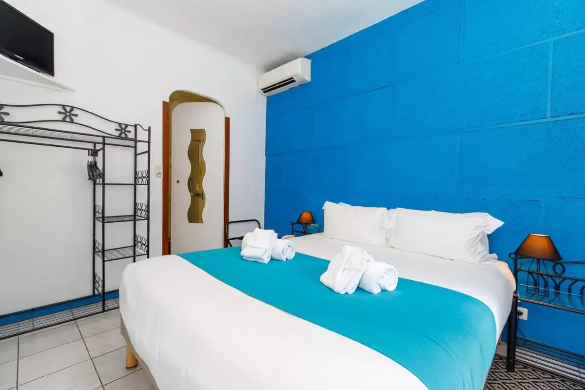 Bed in Hôtel Les Liserons de Mougins Bed in Hôtel Les Liserons de Mougins