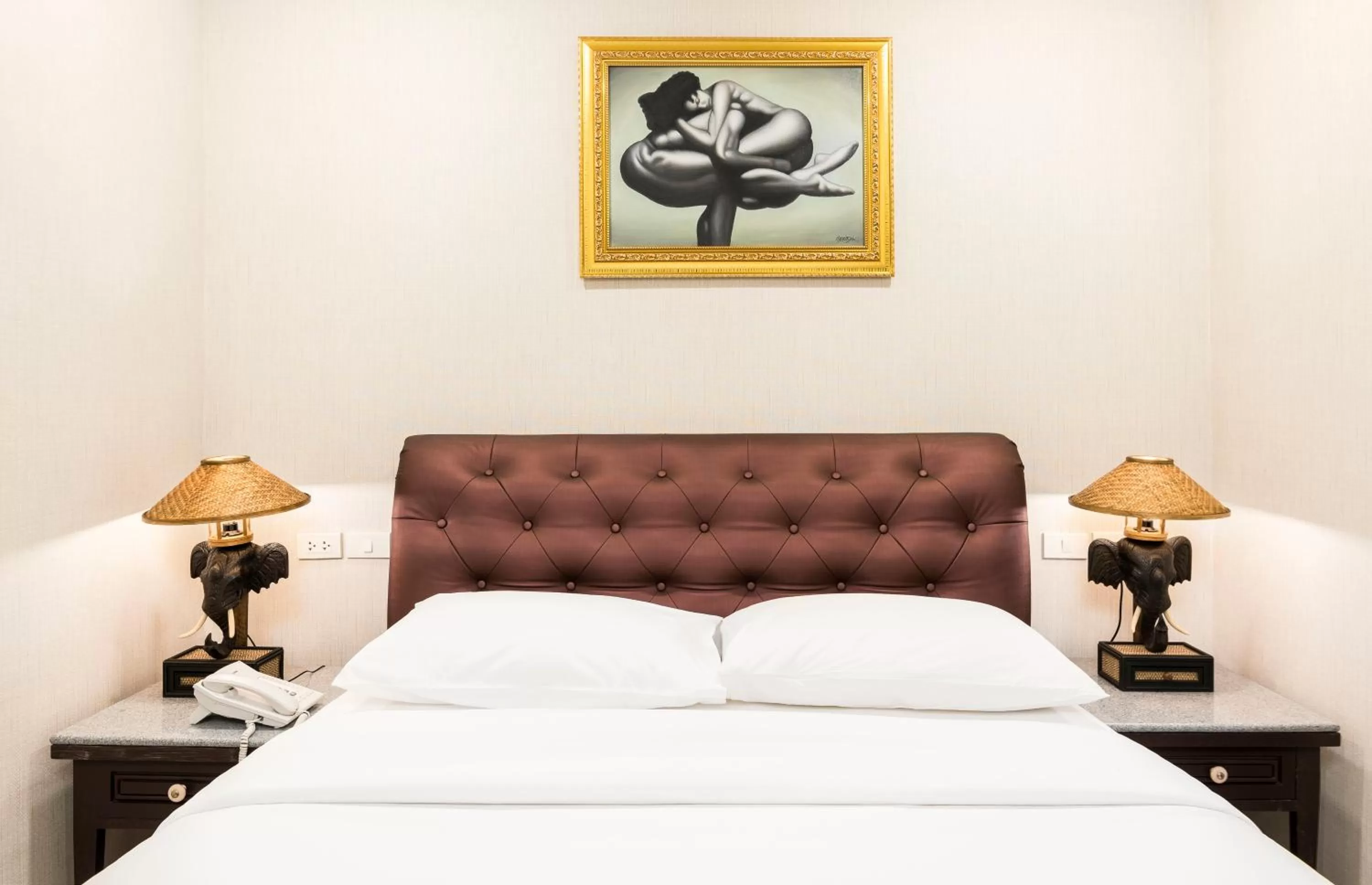 Bed in The Ambiance Hotel