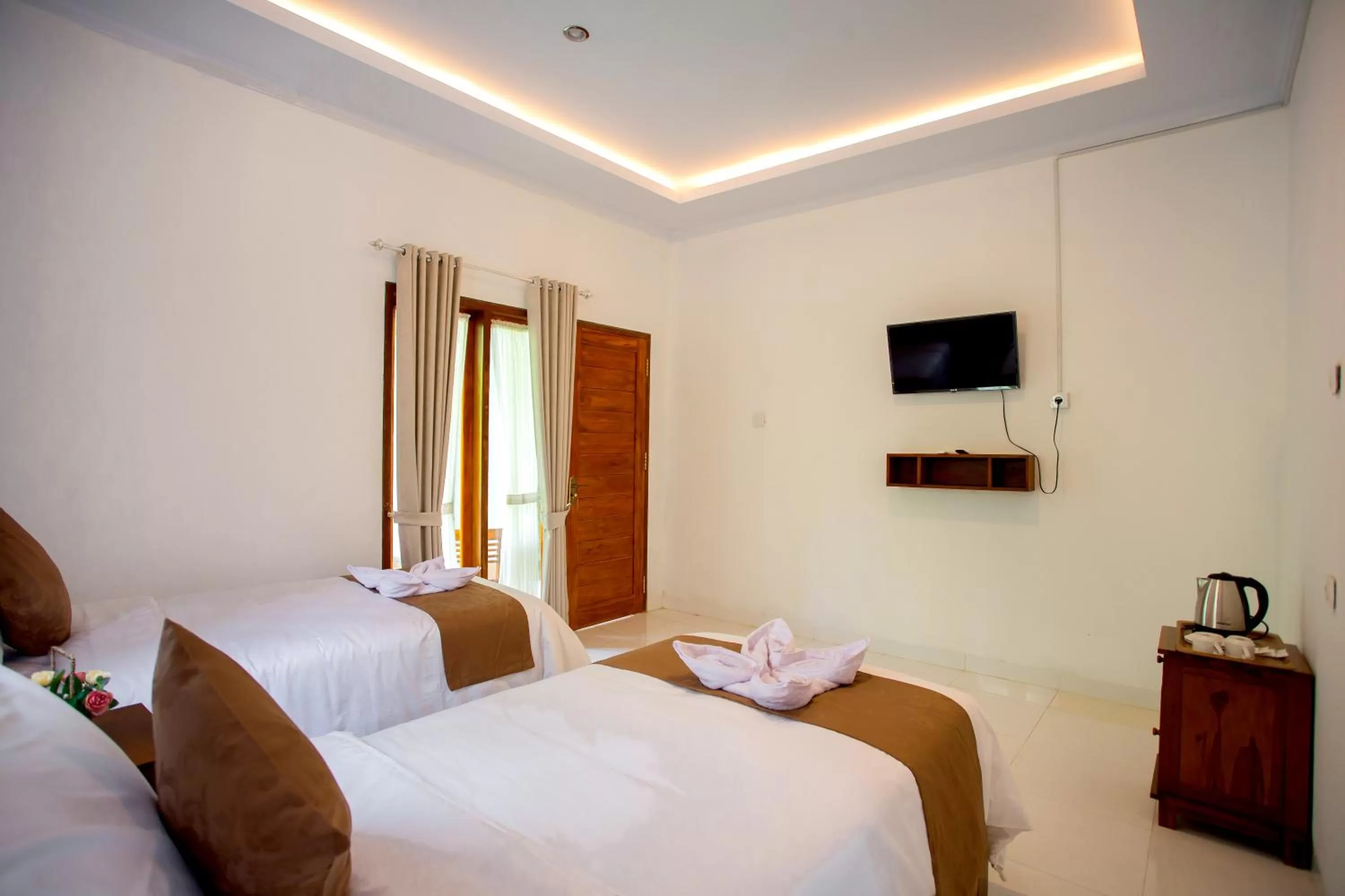 Bed in The Puncak Santhi Inn