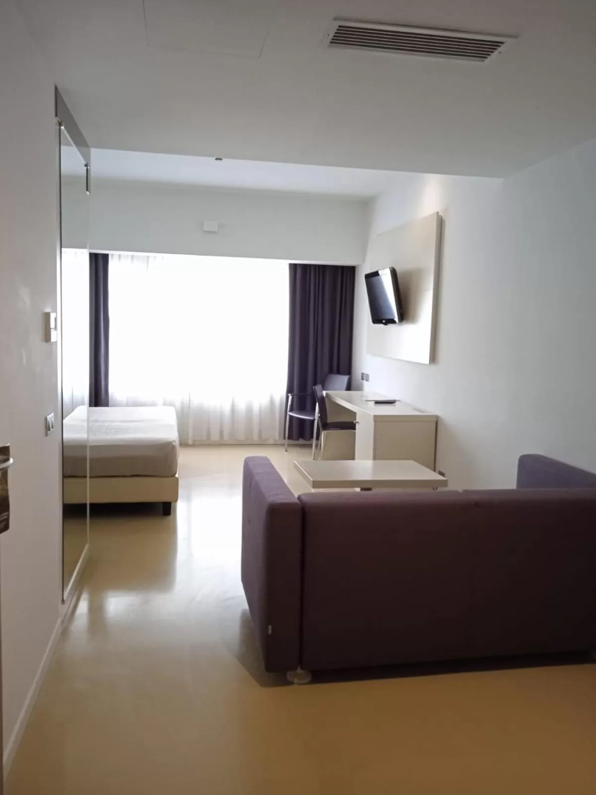 Living room, Bed in Hotel Poseidon