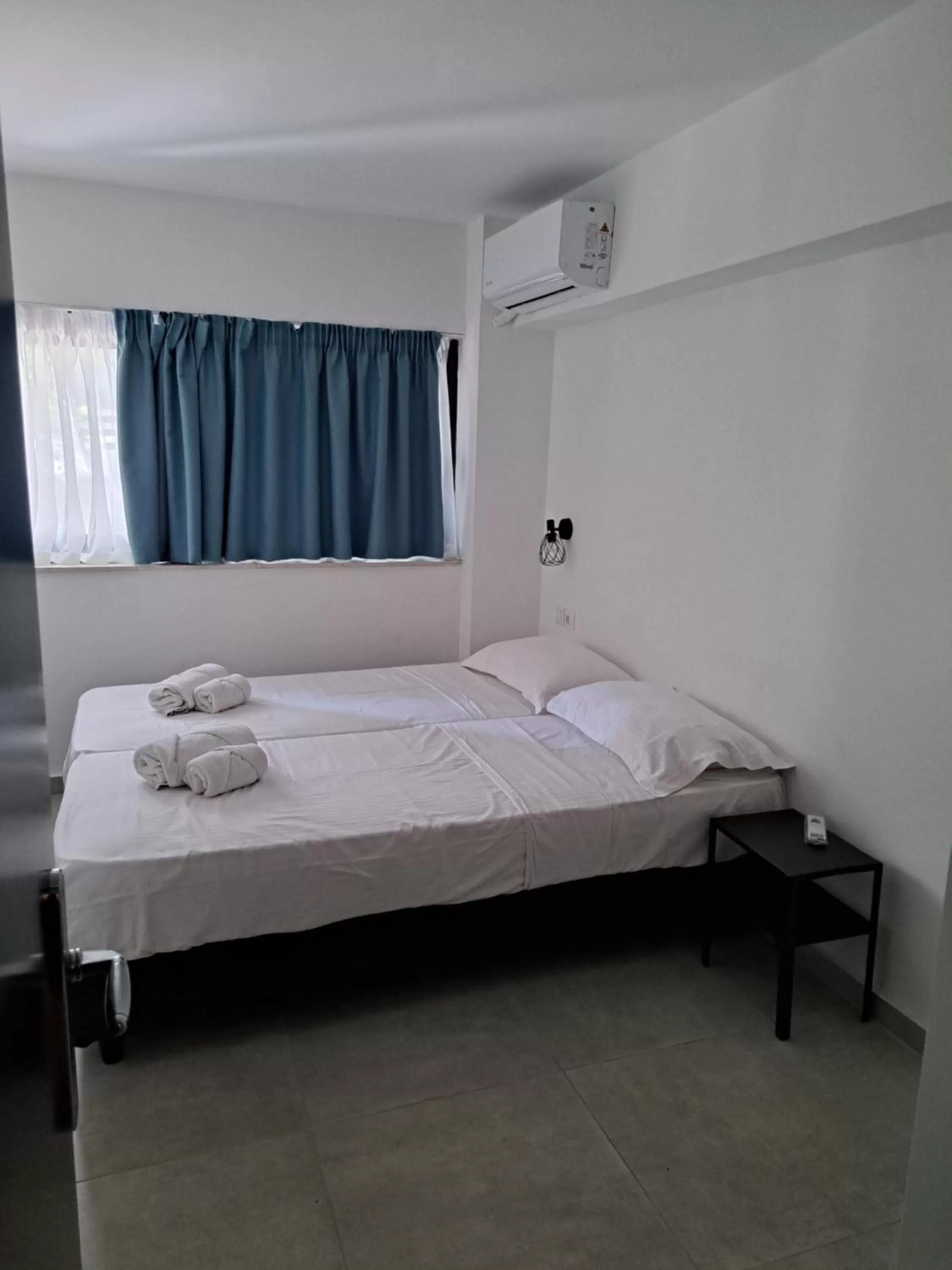 Bed in Evita's Luxury Apartments