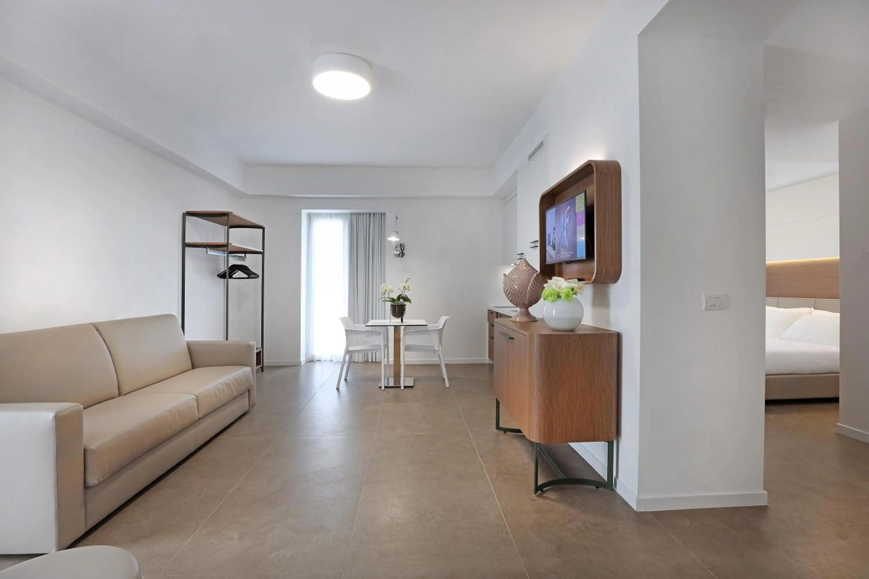 Seating area, Bed in M&F Hotel