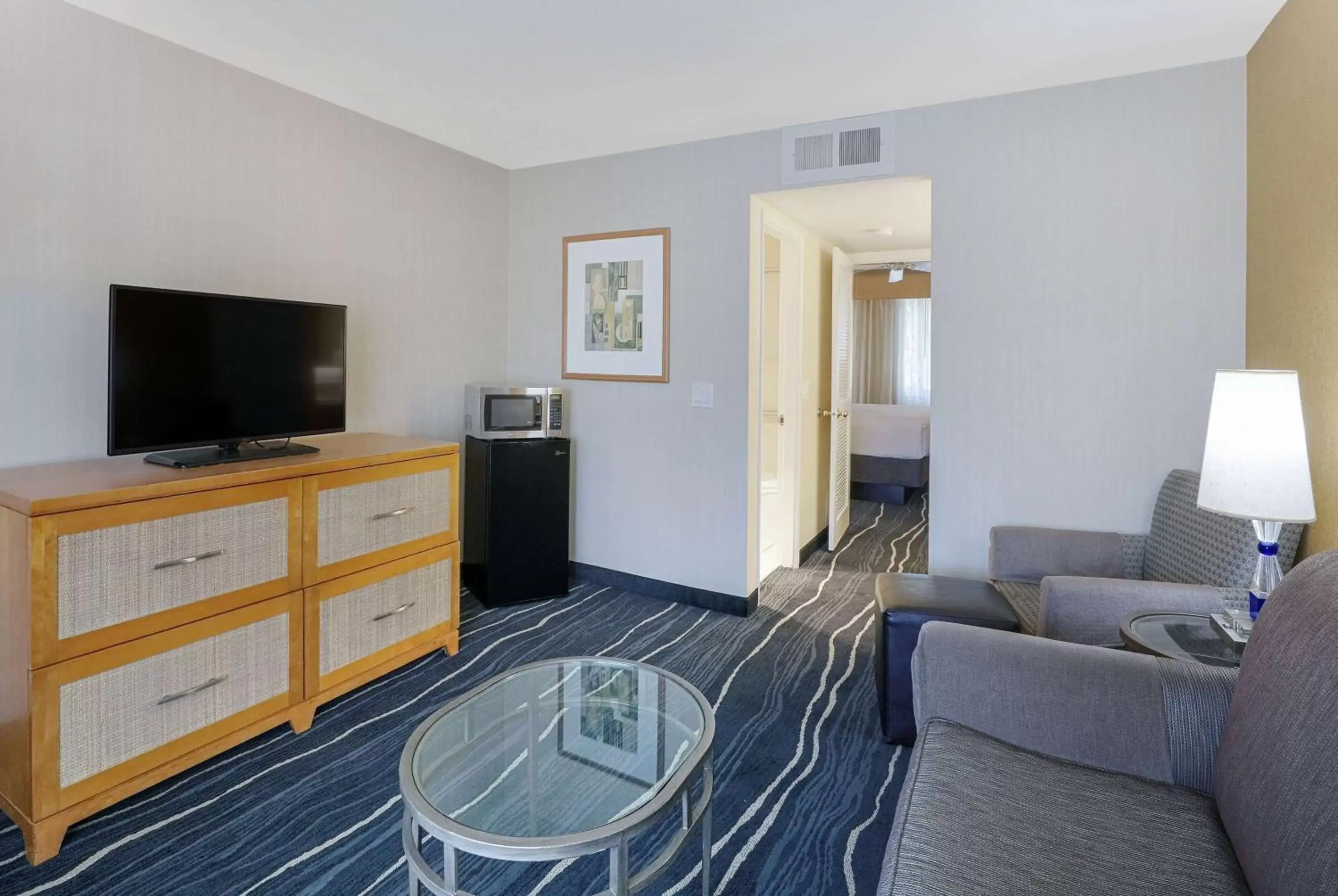 Photo of the whole room, TV/Entertainment Center in Ramada by Wyndham Costa Mesa/Newport Beach