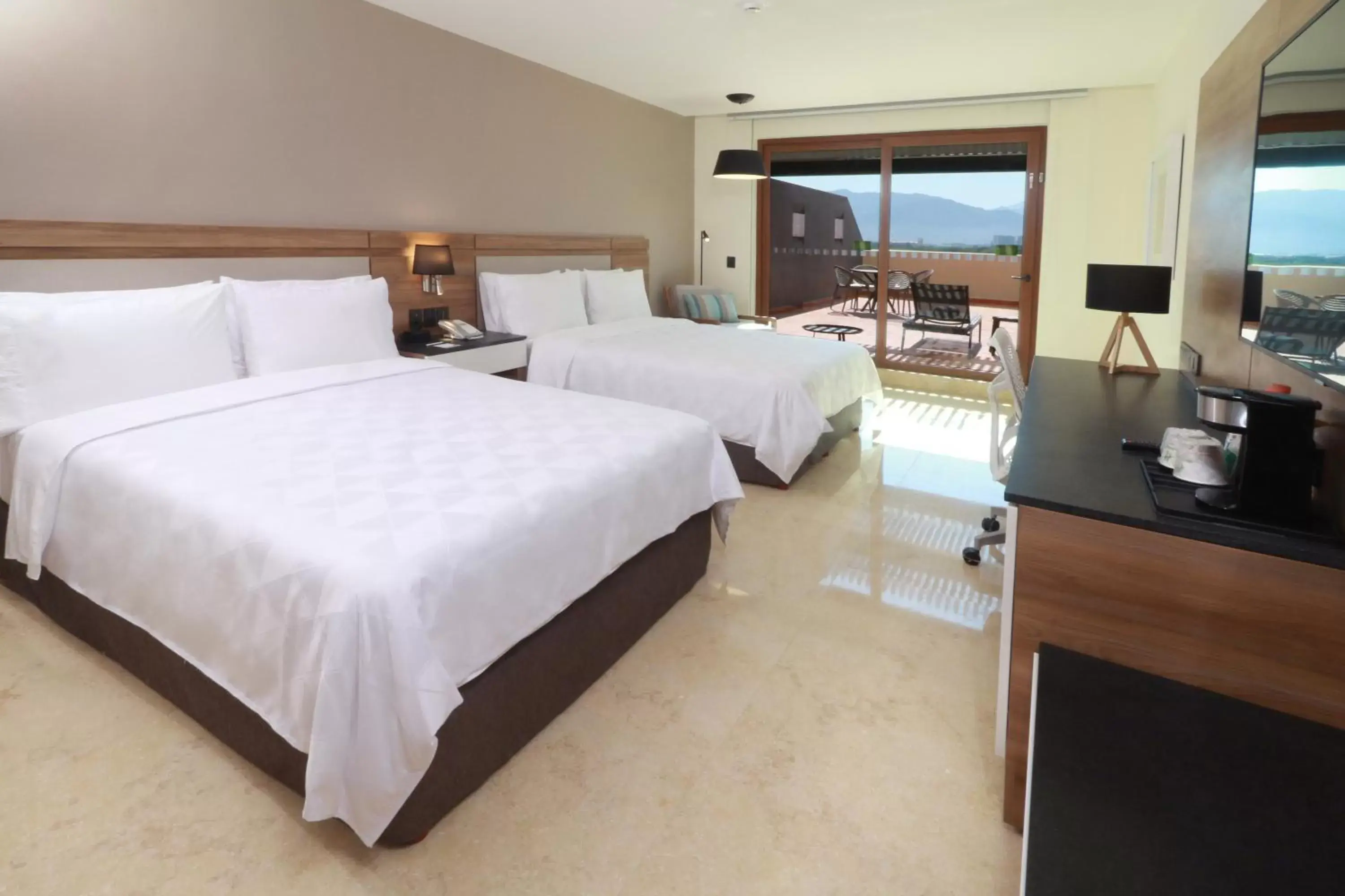 Photo of the whole room, Bed in Holiday Inn & Suites - Puerto Vallarta Marina & Golf, an IHG Hotel