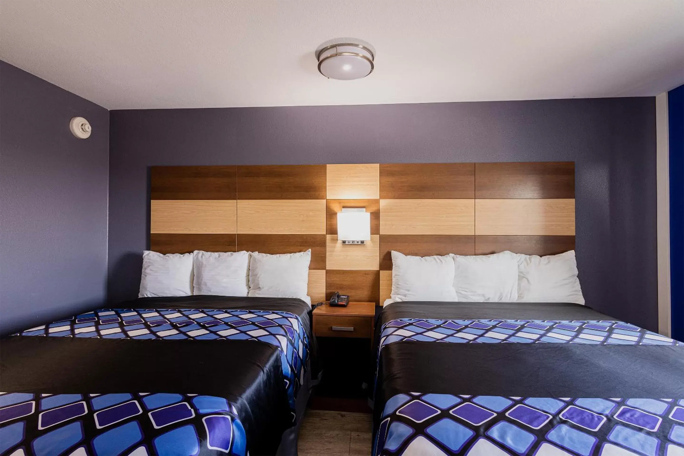 Bed in Coratel Inn & Suites by Jasper Inver Grove Heights