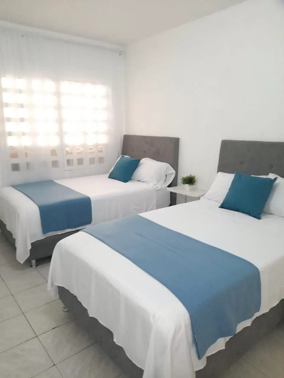 Bed in Tita’s Airport Hotel