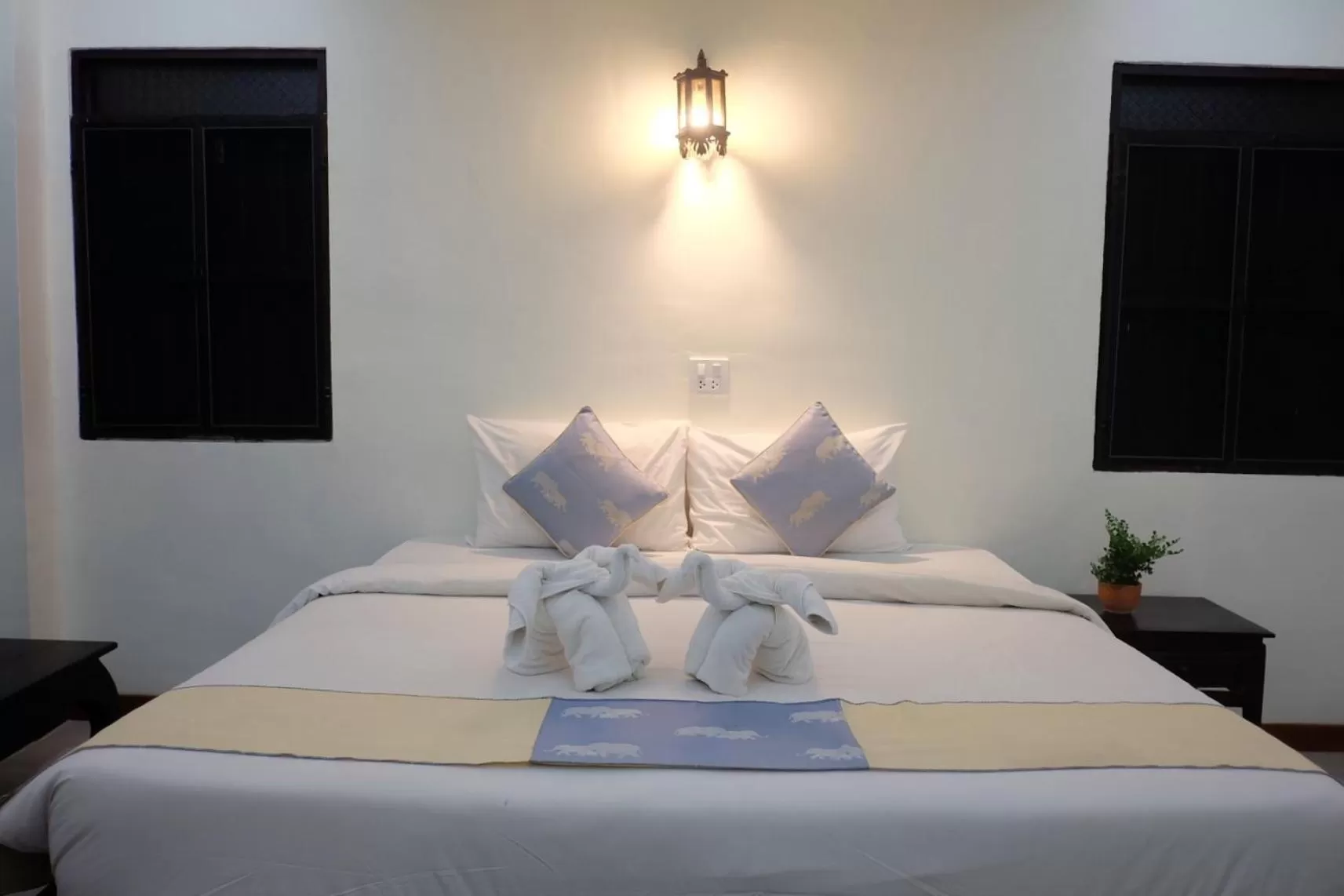 Bed in Rainforest Huahin Village Hotel