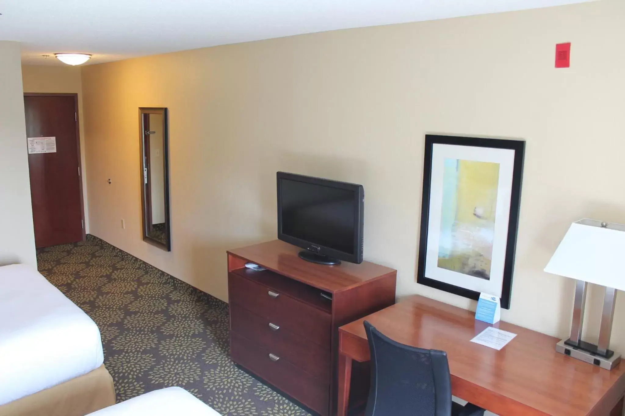 Photo of the whole room, TV/Entertainment Center in Holiday Inn Express Hotel & Suites Starkville, an IHG Hotel