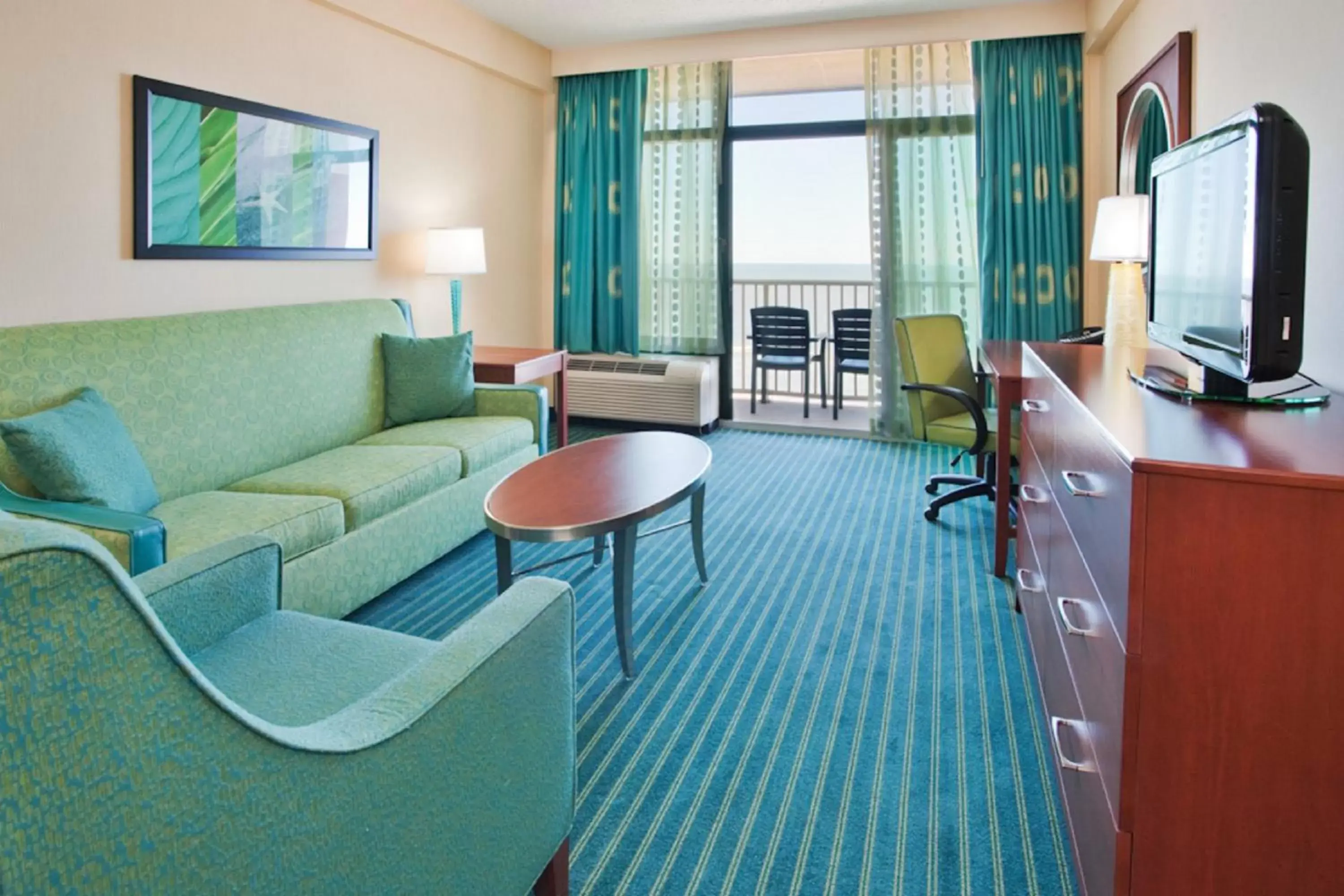 Photo of the whole room, Seating Area in Holiday Inn & Suites Virginia Beach - North Beach, an IHG Hotel