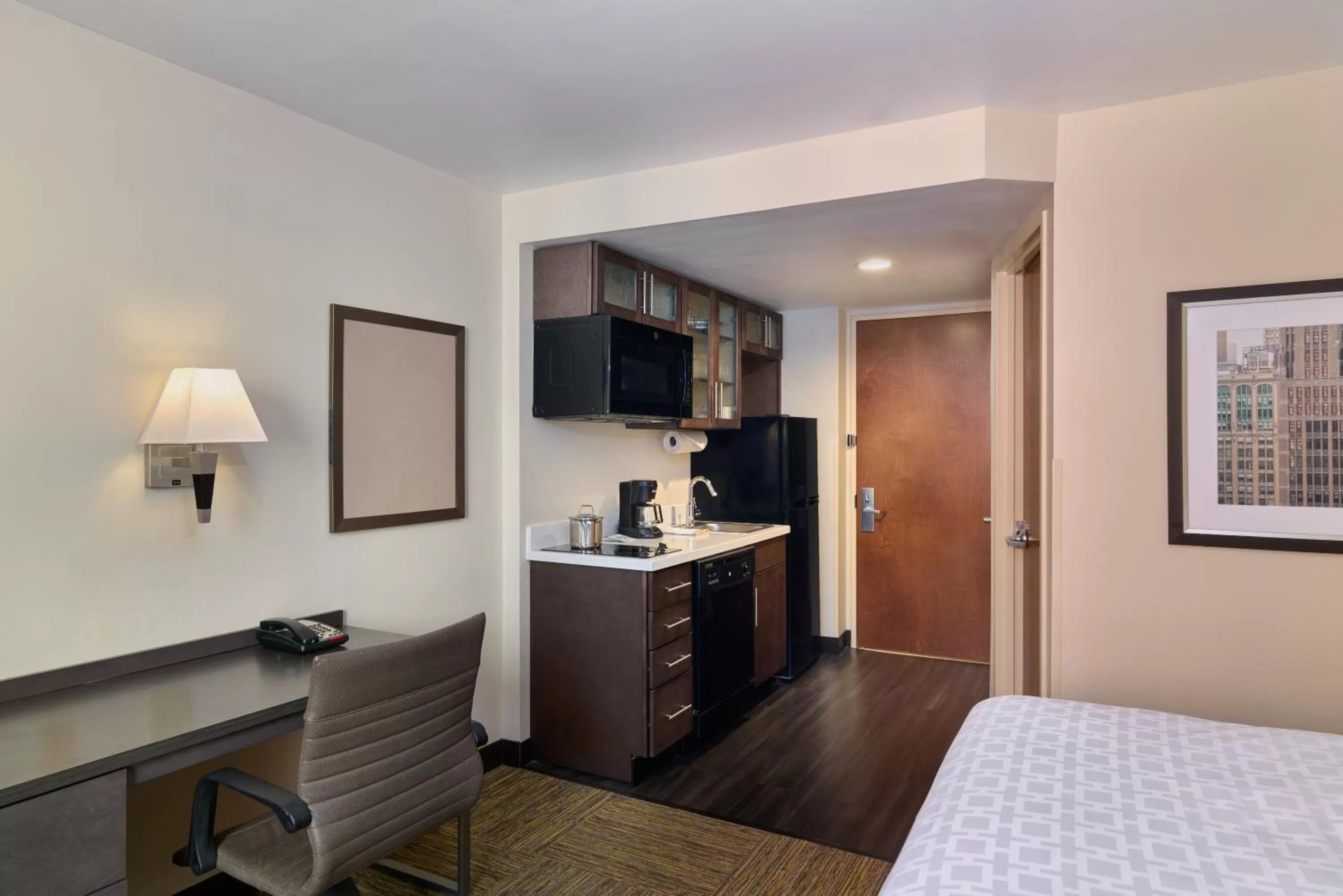 Kitchen or kitchenette, Bed in Candlewood Suites NYC -Times Square by IHG