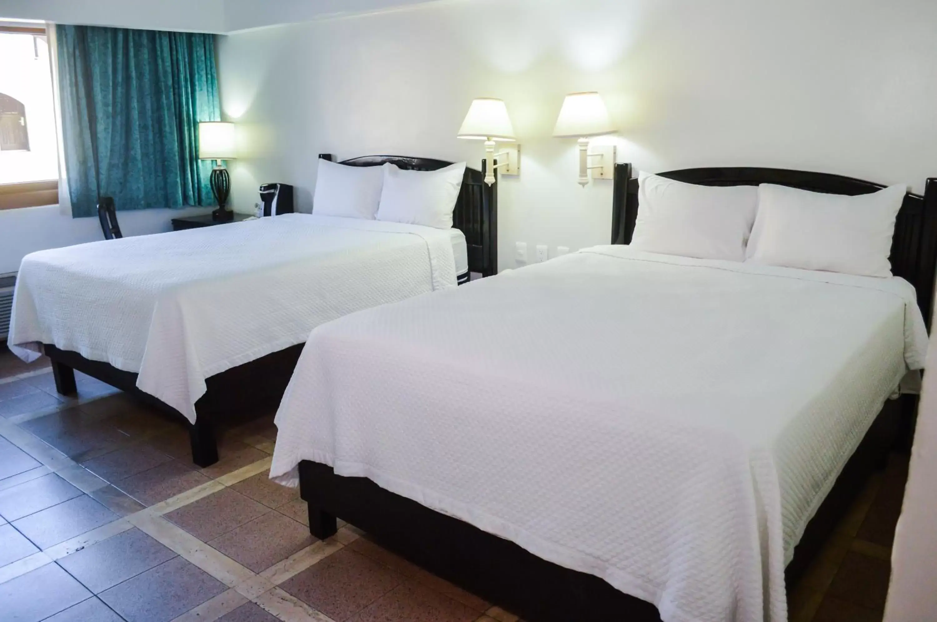 Bed in Gamma Guaymas Armida Hotel
