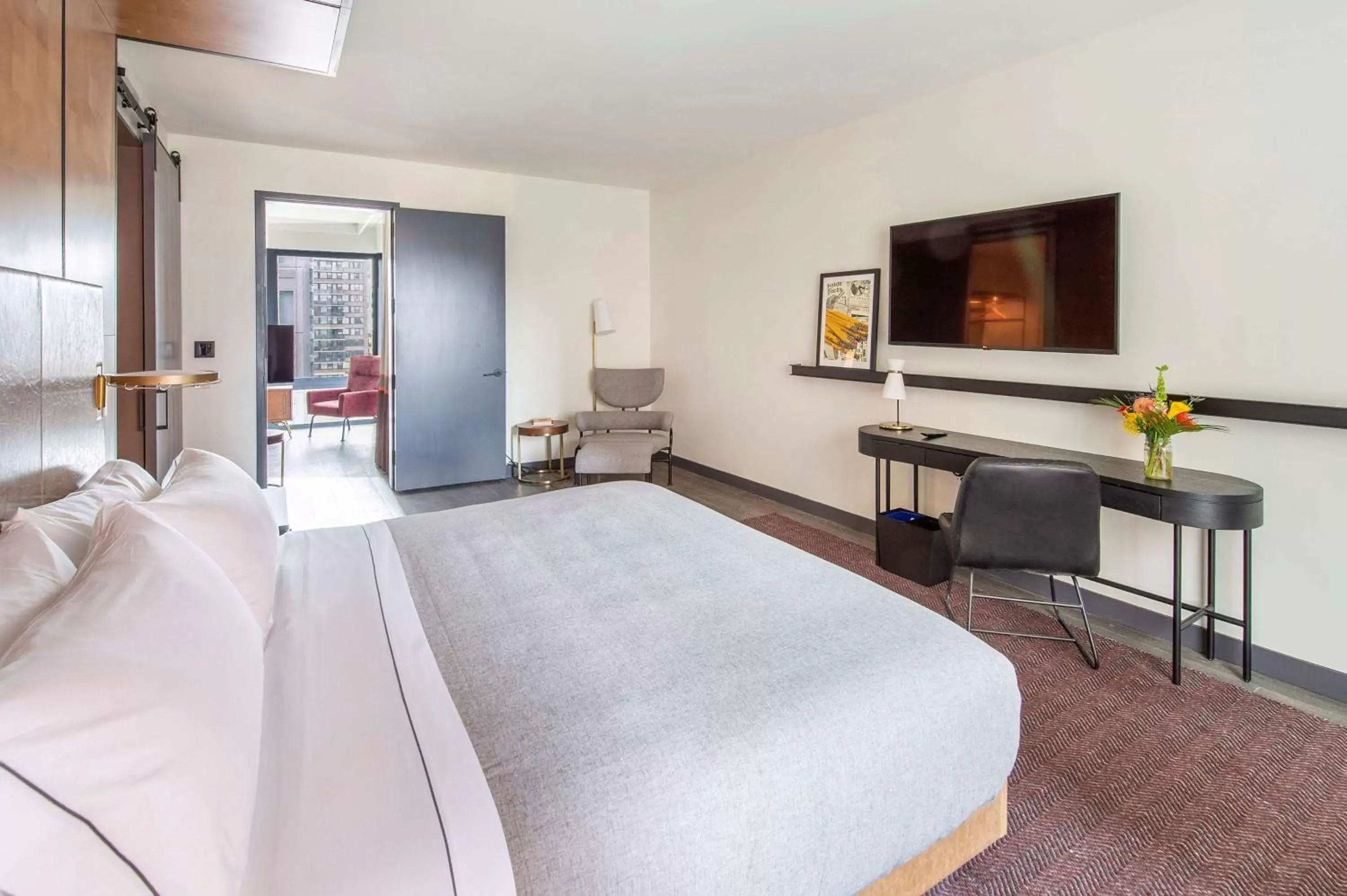 Bedroom, TV/Entertainment Center in Canopy By Hilton Jersey City Arts District