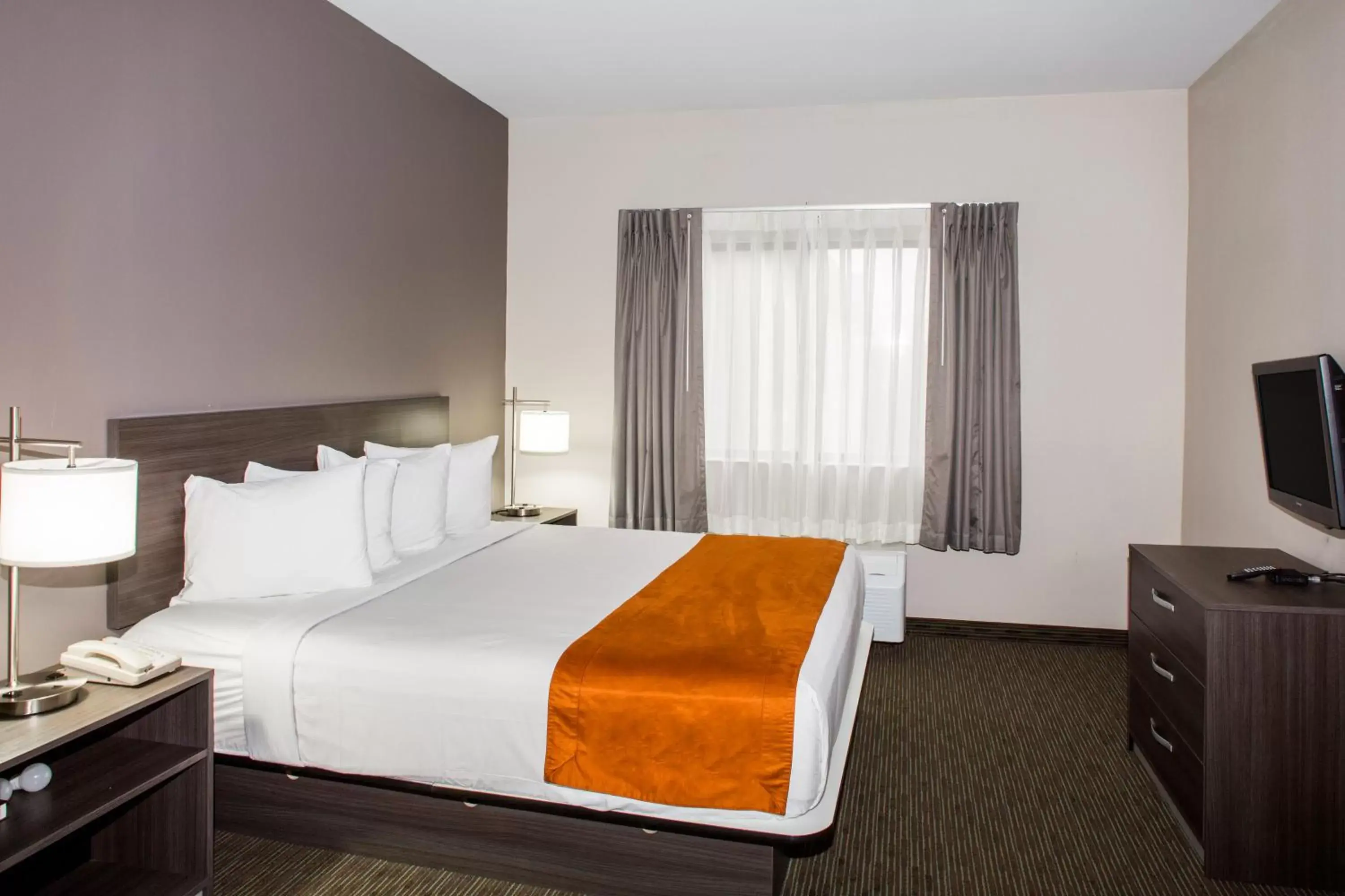Decorative detail, Bed in Days Inn & Suites by Wyndham Orlando Airport