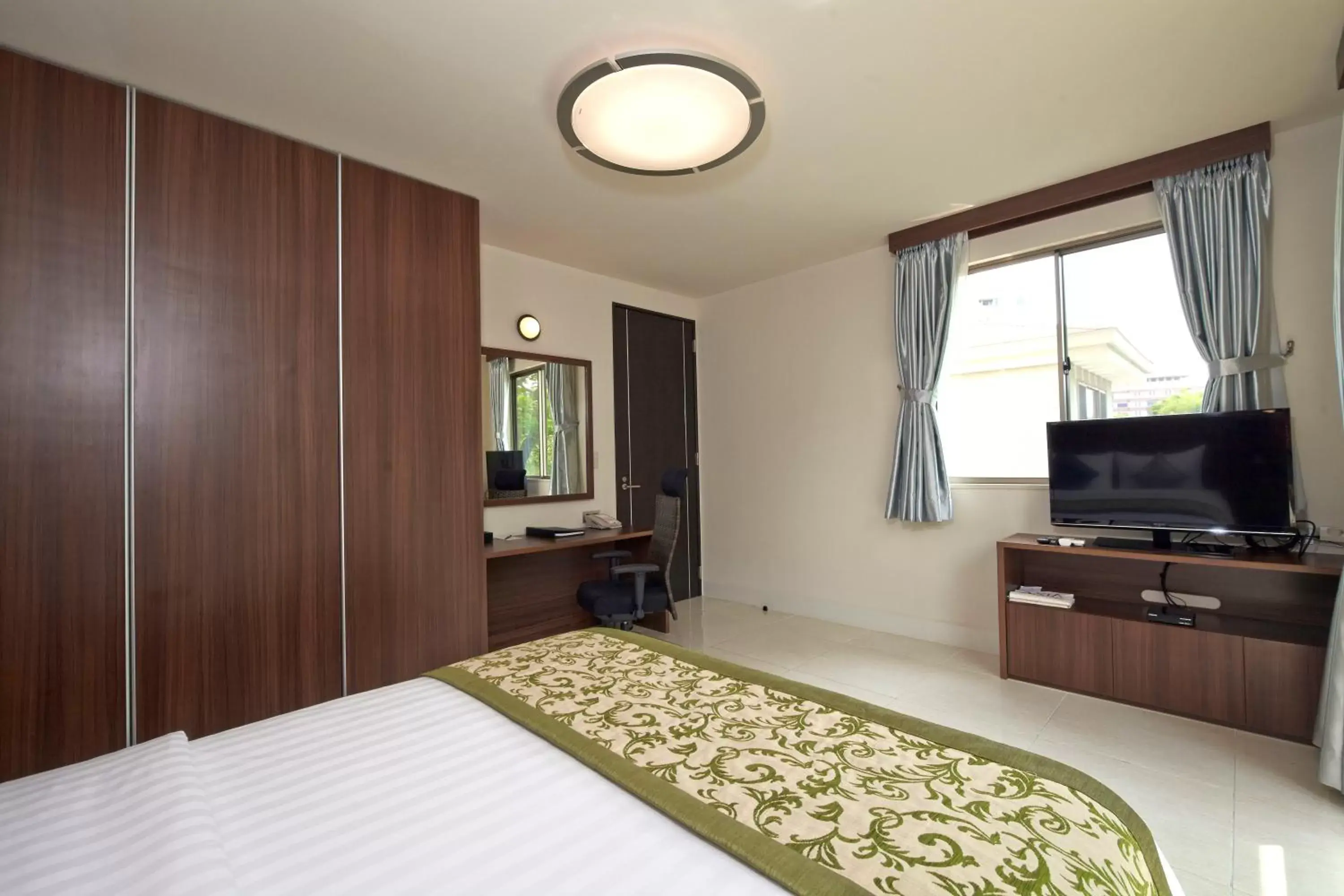 Bedroom, TV/Entertainment Center in Axia South Cikarang Service Apartment